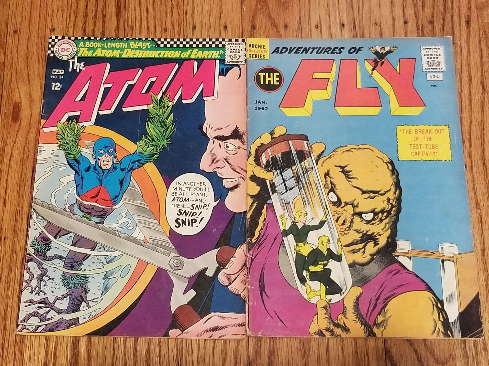 Aged copies of THE ATOM #24 & ADVENTURES OF THE FLY #17.