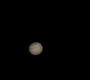 Jupiter, somewhat grainy but with cloud bands clearly visible