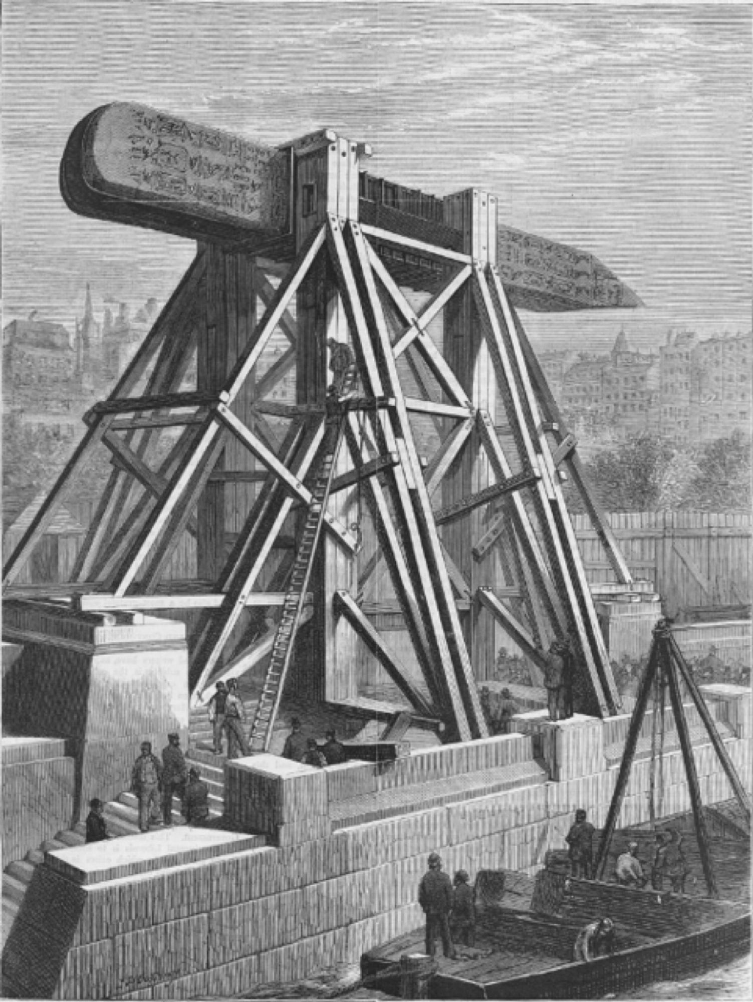 Illustration of Cleopatra's needle from The Graphic (1878) showing the obelisk hoisted in the air, horizontal, on an enormous timber frame.