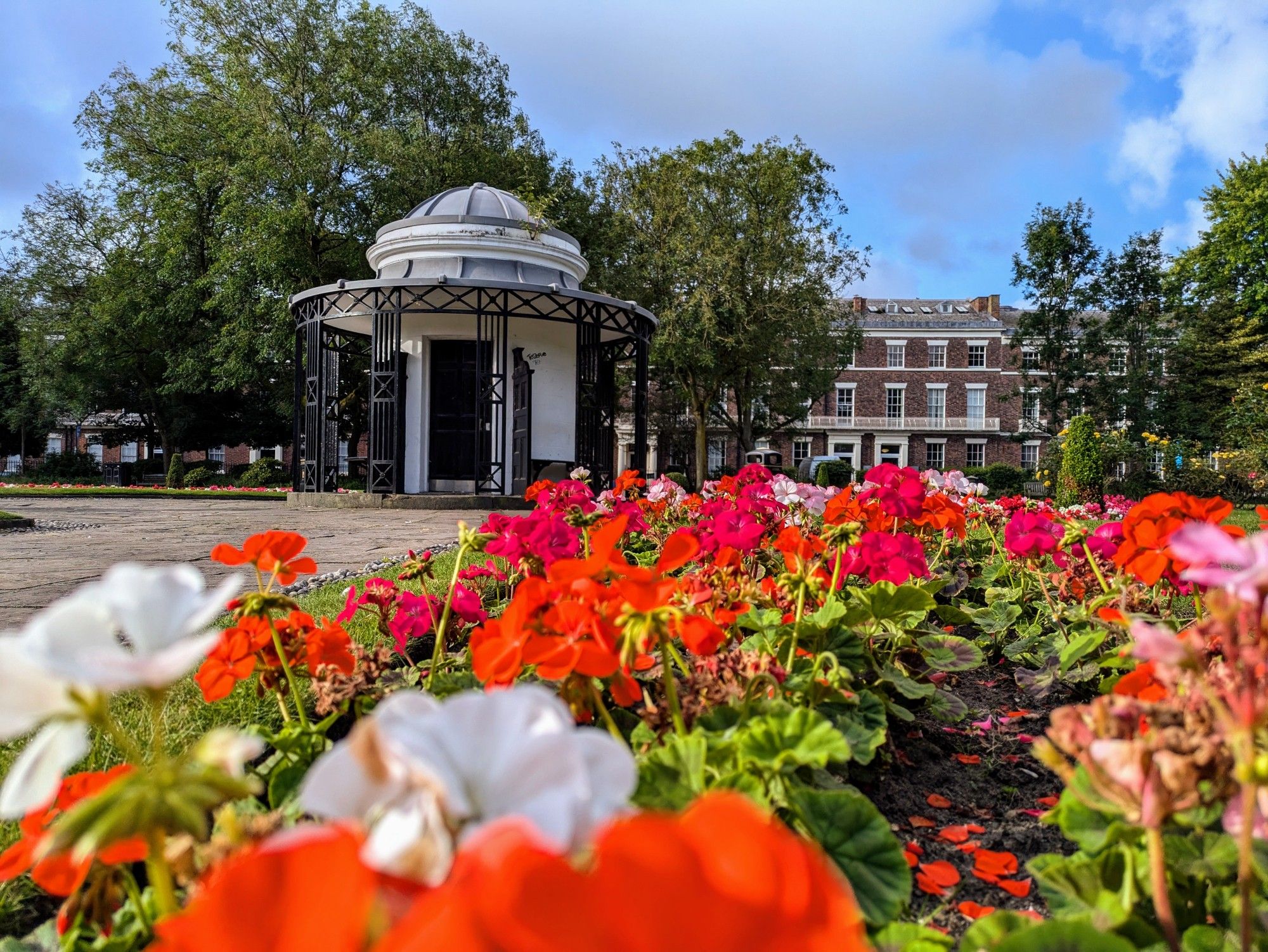 The Abercromby Square rotunda with flowers in the foreground.