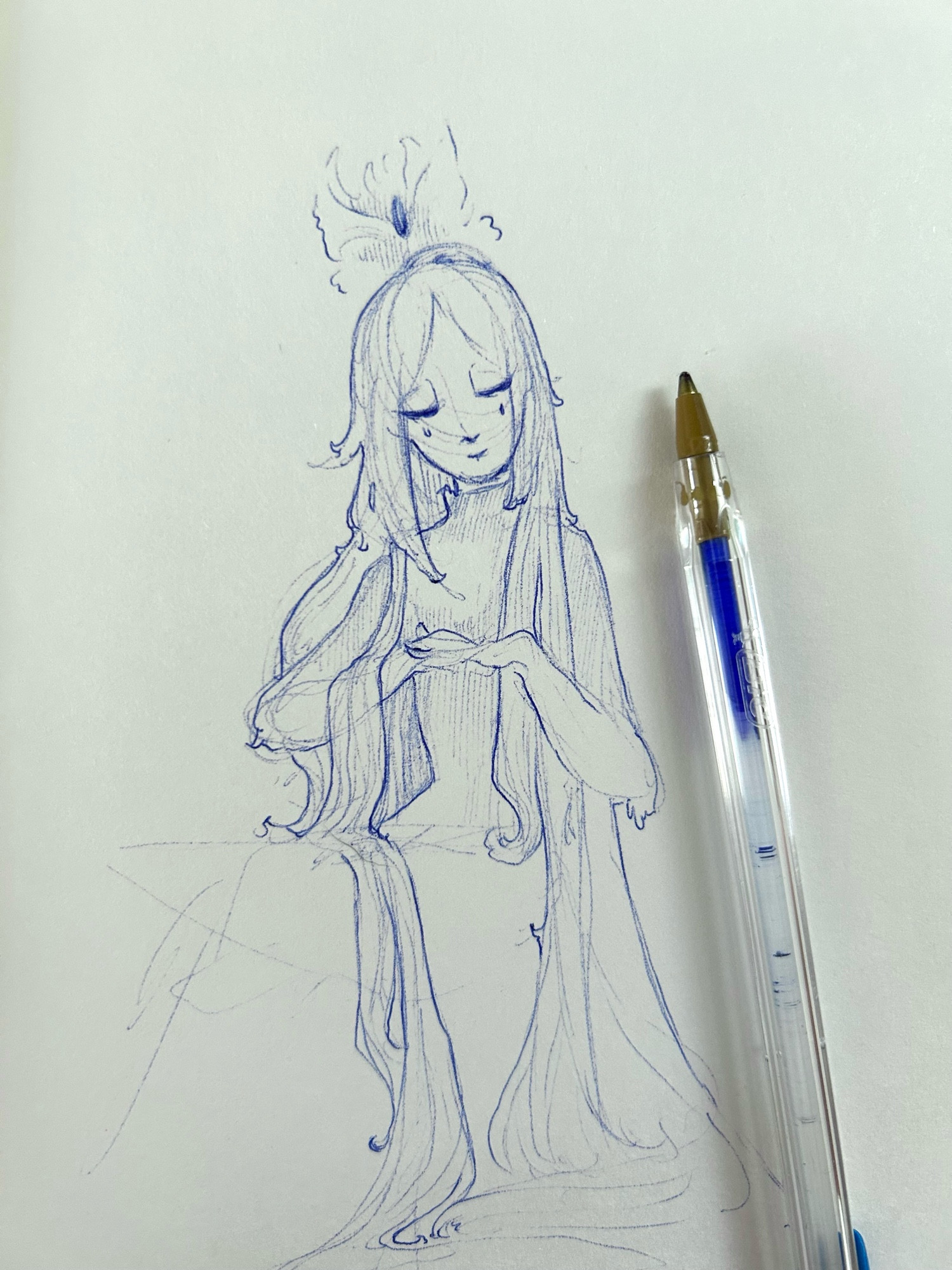 Ballpoint pen sketchbook drawing of a figure with long hair and a winged hair ornament, glancing to their left 