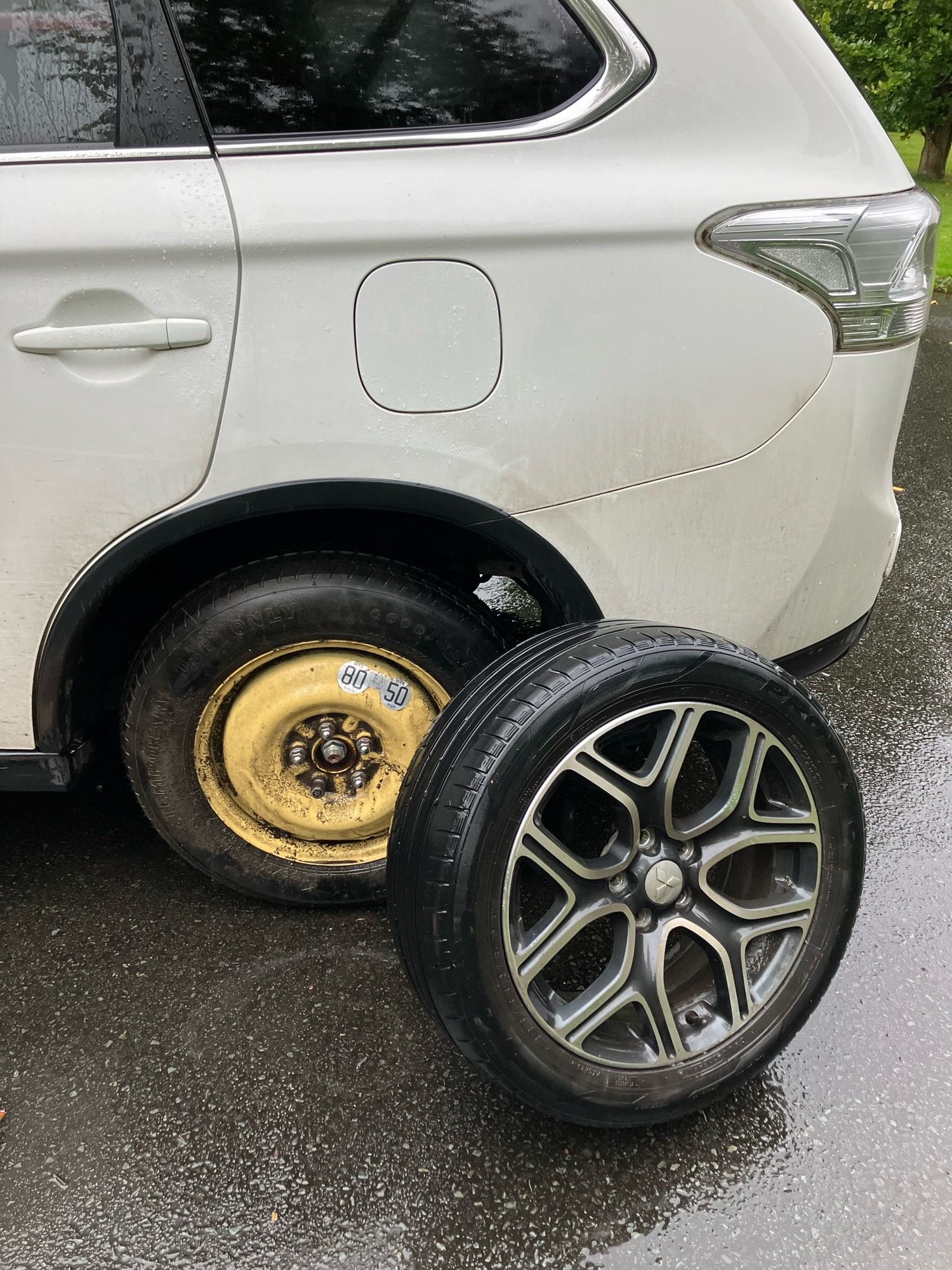 A spare tyre being fitted