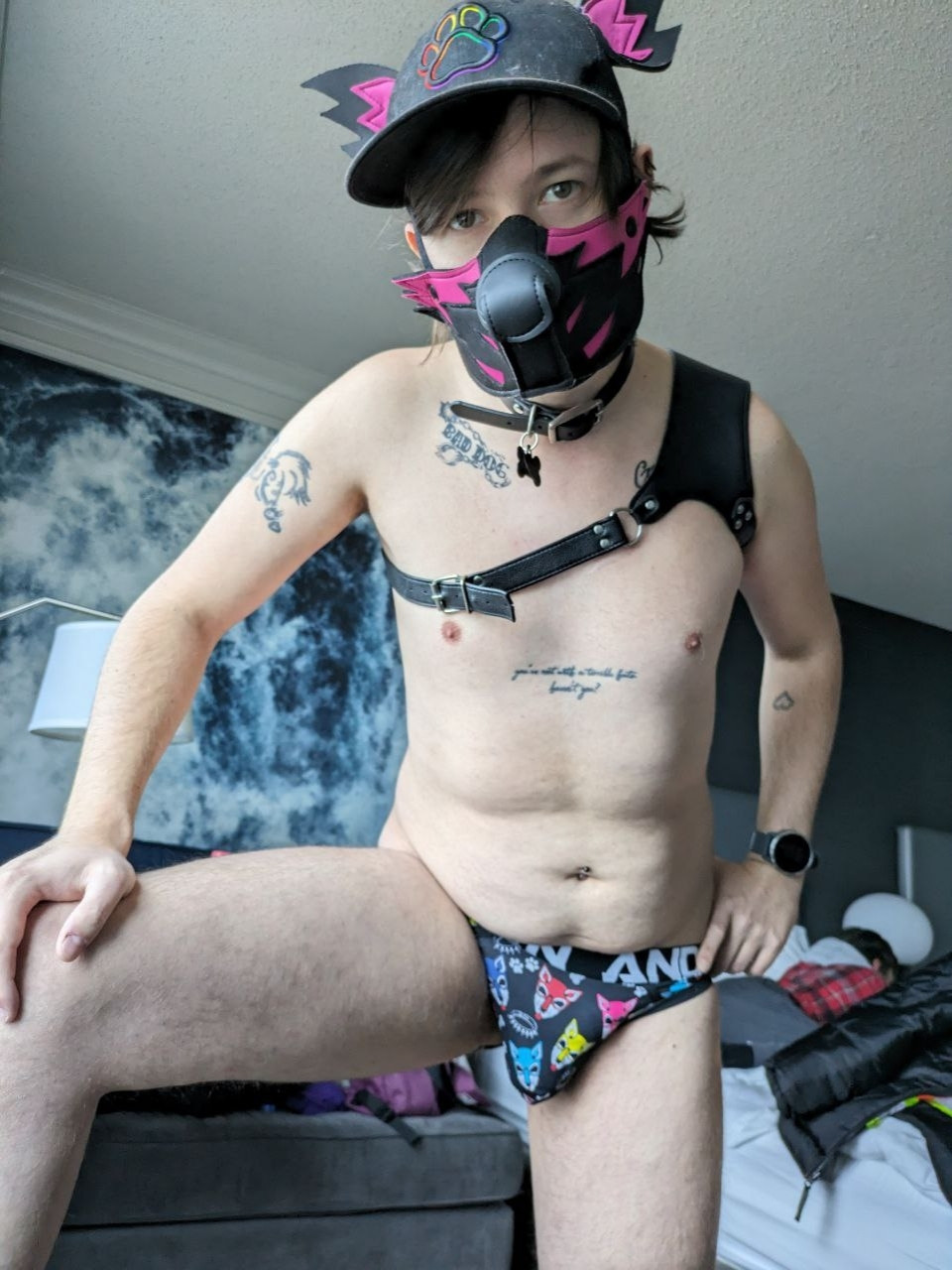 Myself in a harness and paw print underwear leaning over you with my leg up