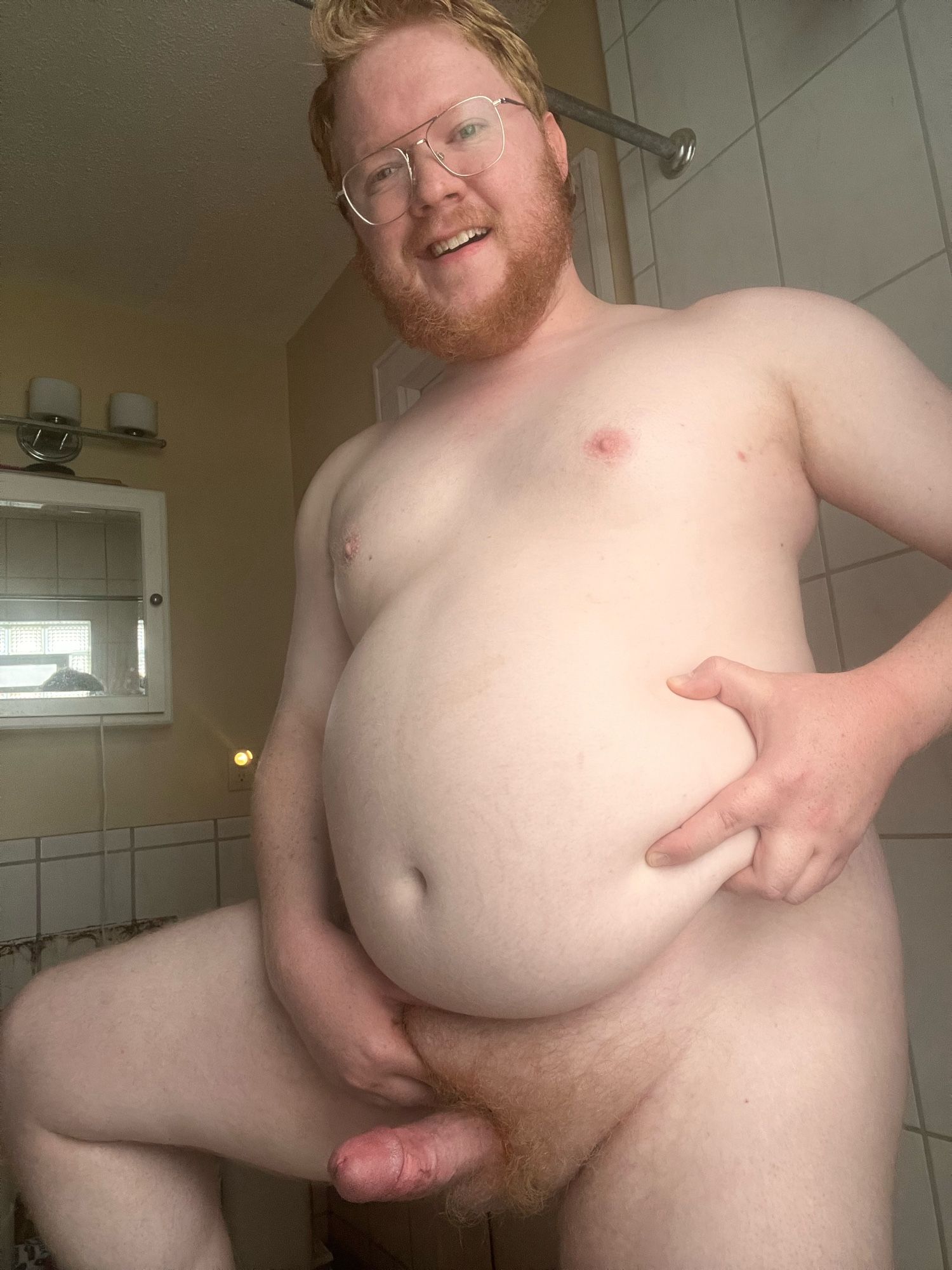 Posing in the bathroom looking fat with a hard cock