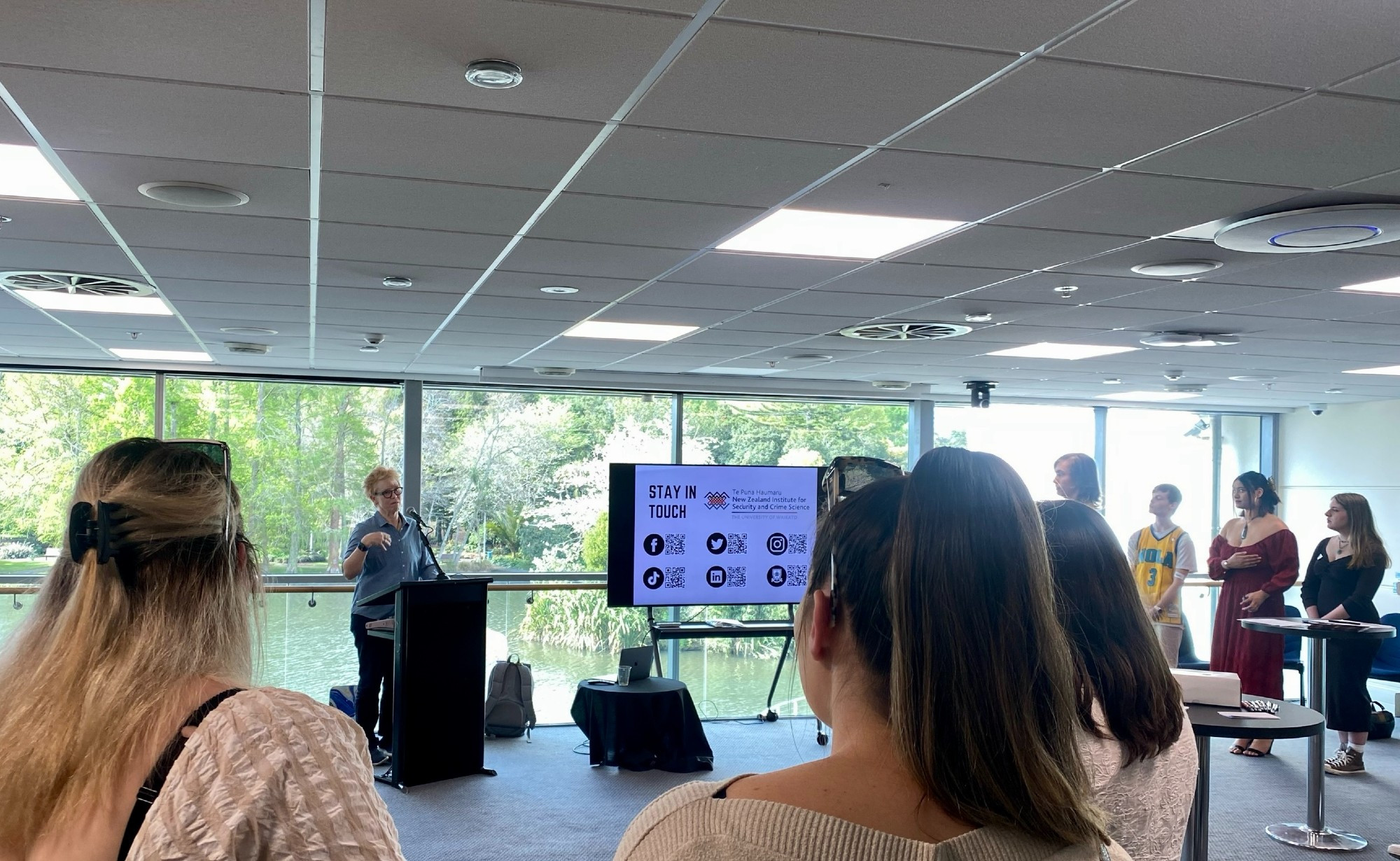 Professor Devon Polaschek welcoming students at Te Puna Haumaru end of year event