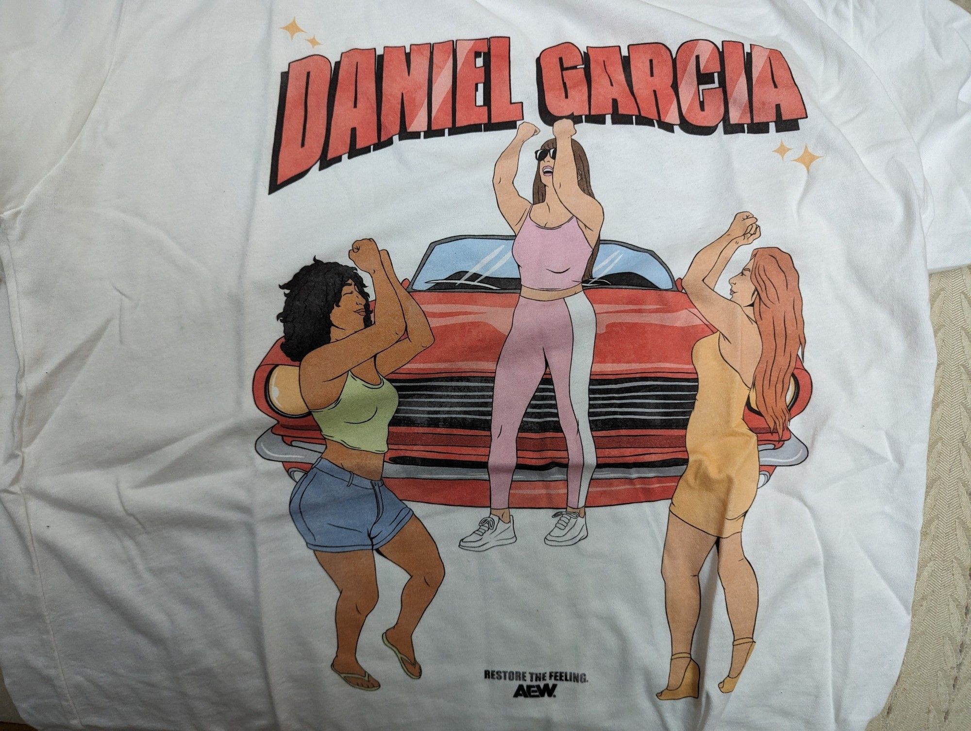 Daniel Garcia shirt with the girls dancing in front of the car