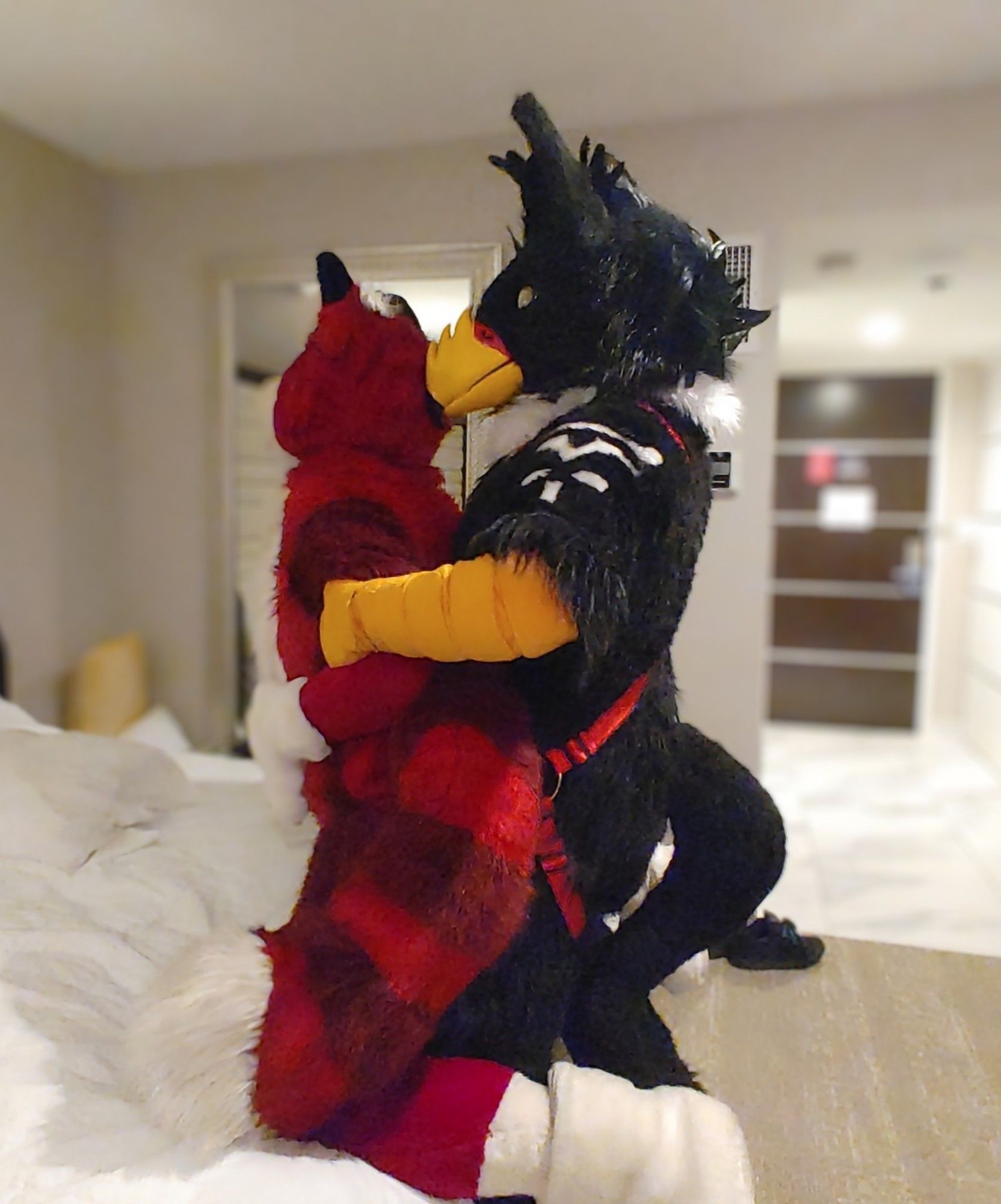 Storm Gryphon fucking a red fursuiter against the bed, pulling their arms against him as he thrusts up into their ass deep.