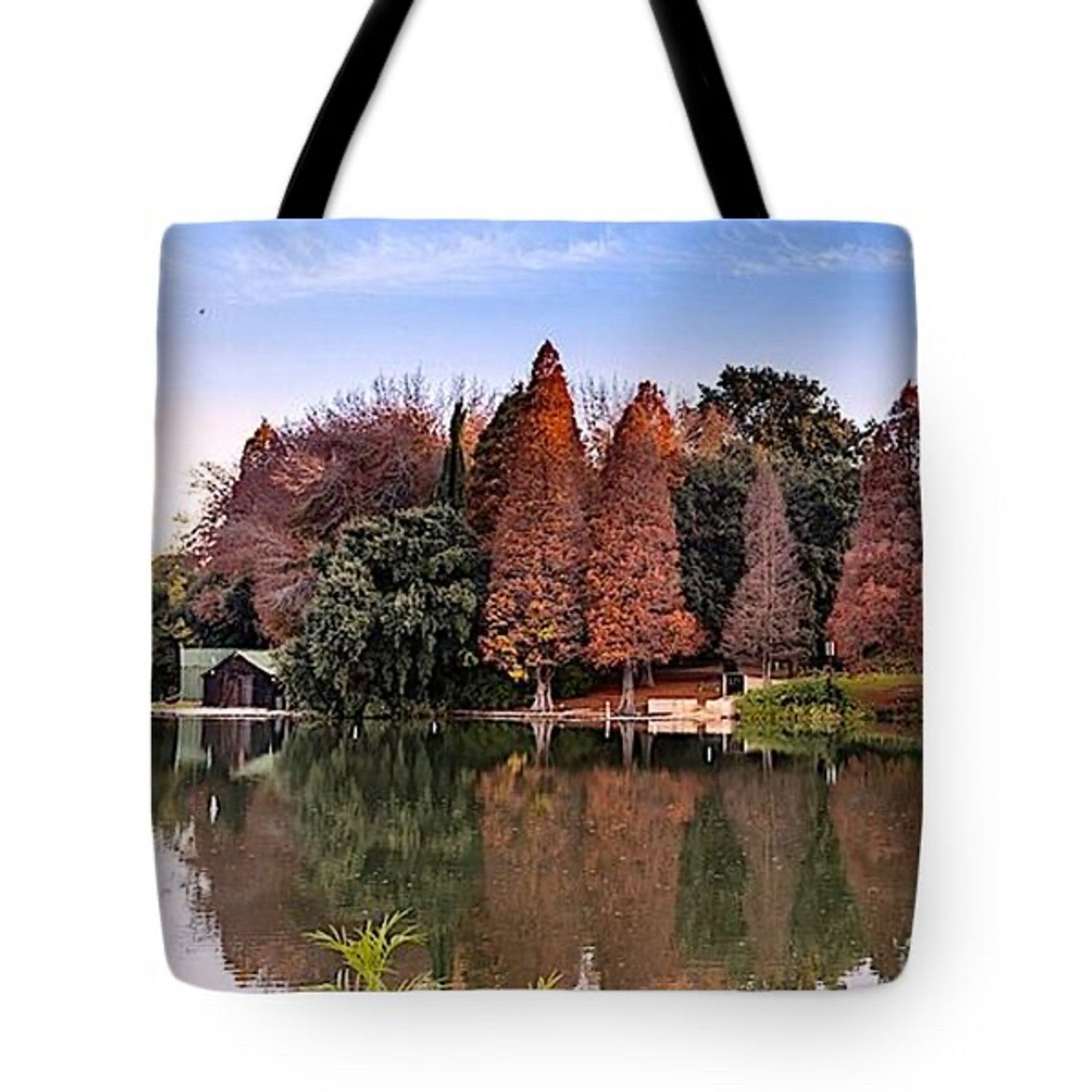 Tote Bag with a lake and trees on the embankment as the art theme. The reflection of the trees on the water surface is noticeable.