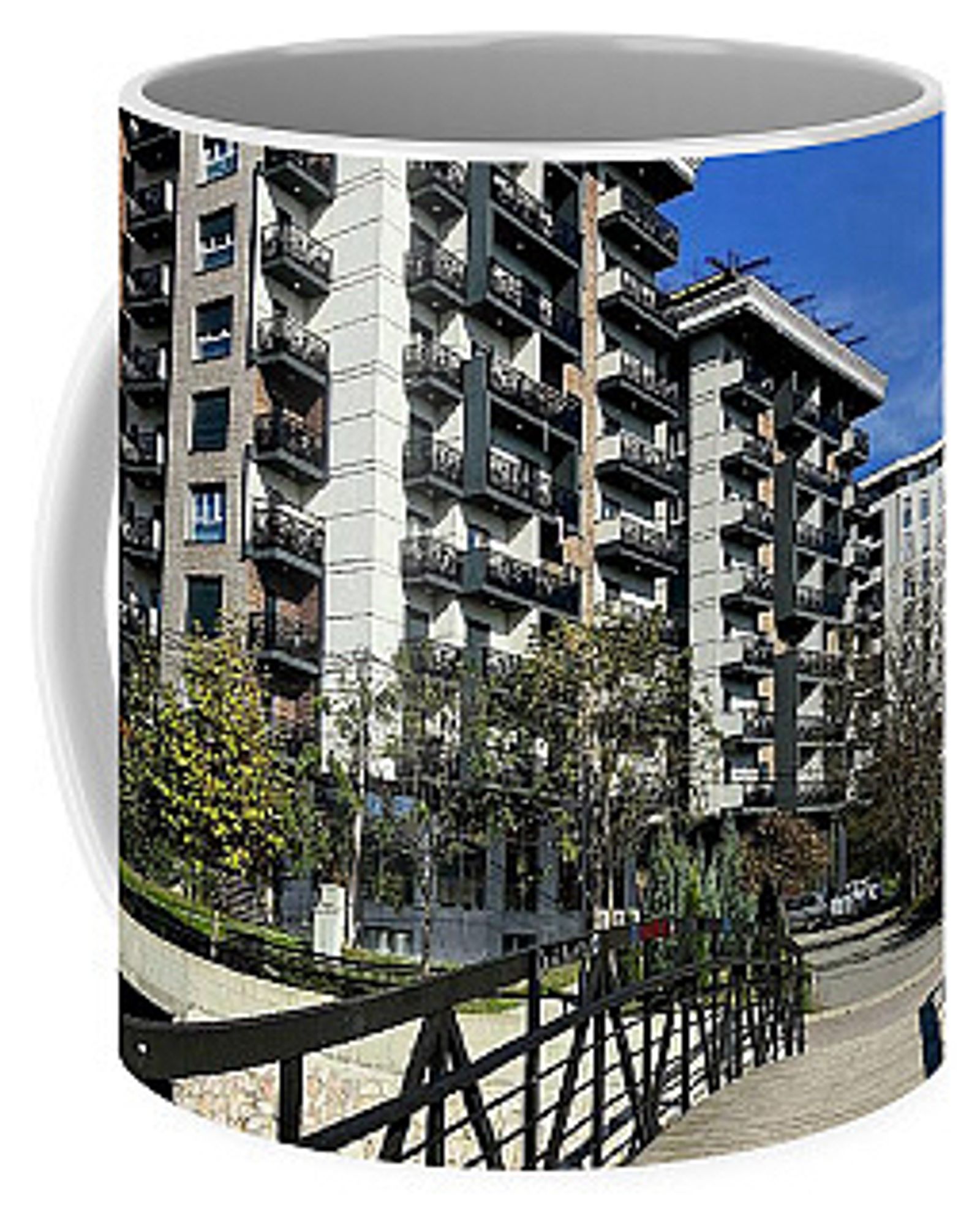 Urban lifestyle - Apartments and pedestrian bridge depicted on a coffee mug.