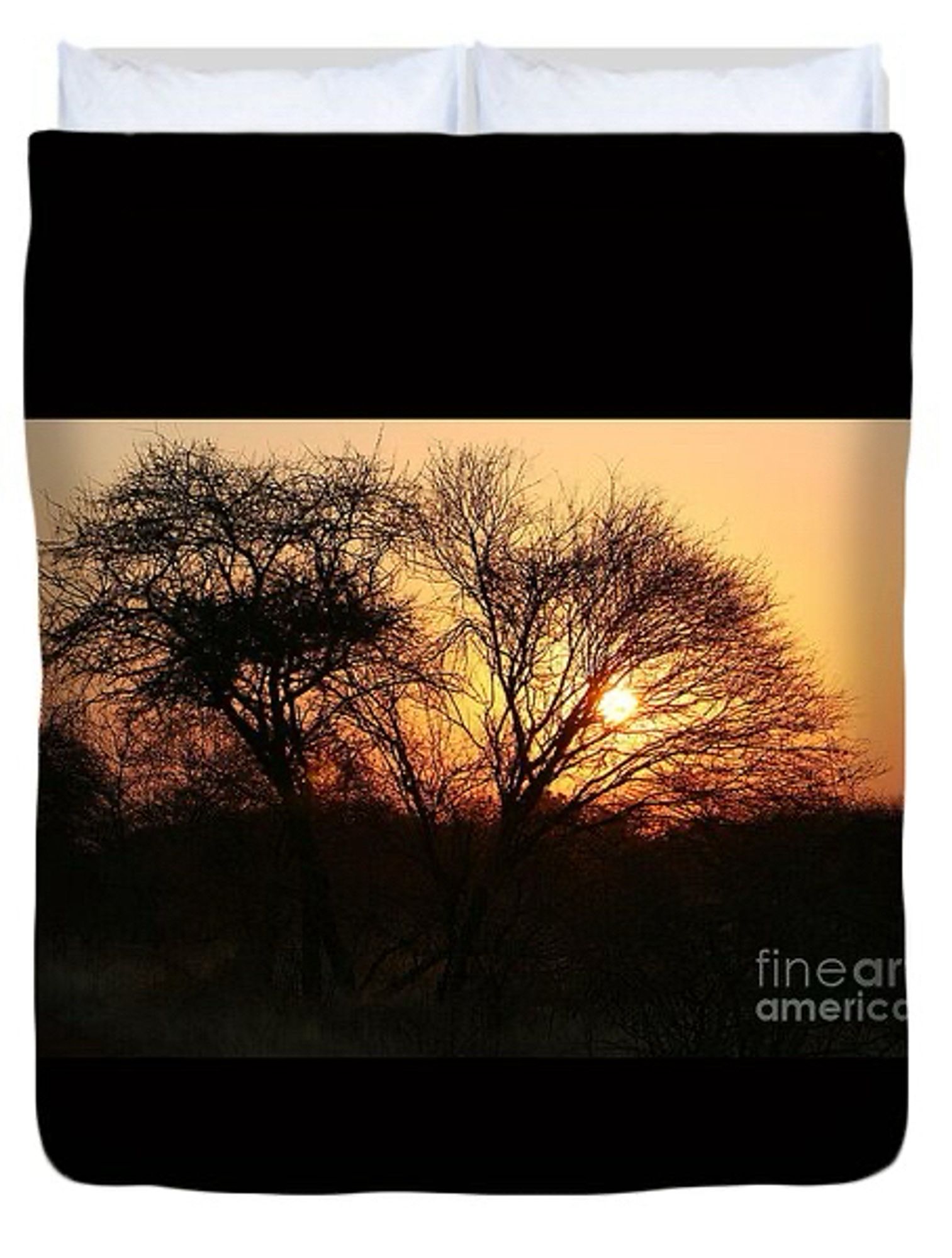 Duvet cover with silhoetted trees against an orange sunset.