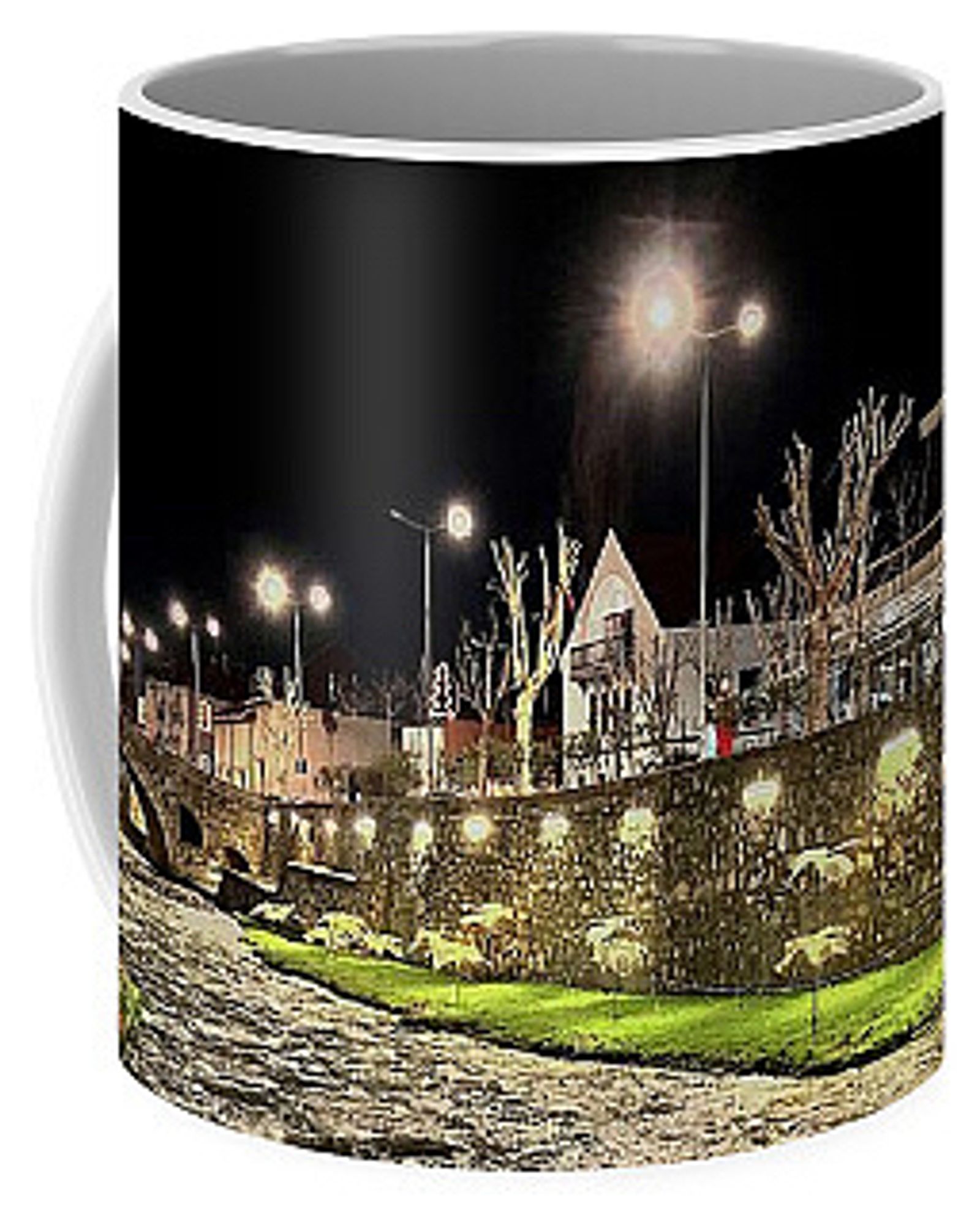 Coffee Mug with a night scene of a river running through a city. There is a stone bridge and buildings visible too.