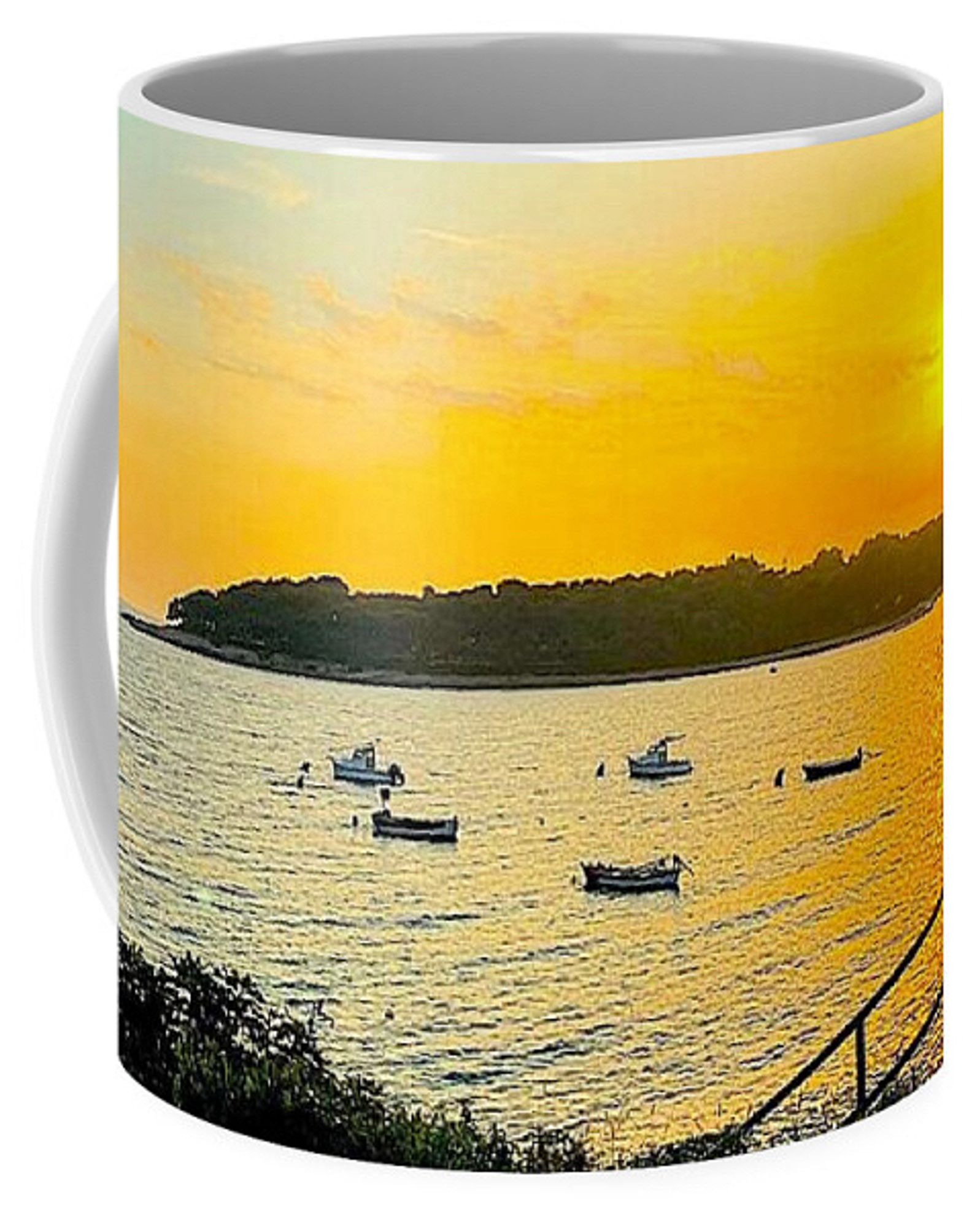 Coffee Mug with a sunset over a bay depicted on it.