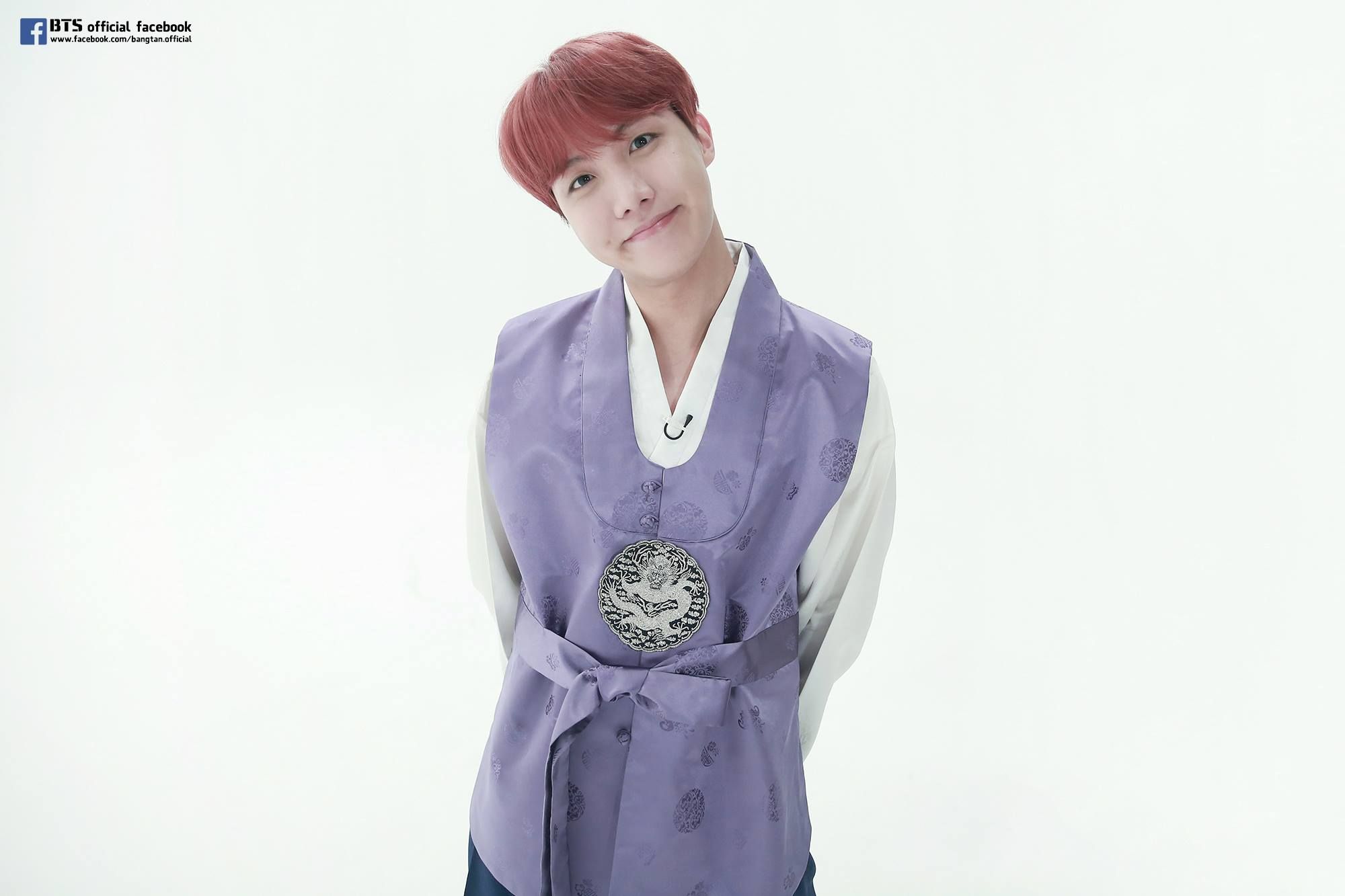 Photo of j-hope with red hair in a purple hanbok, taken in 2018