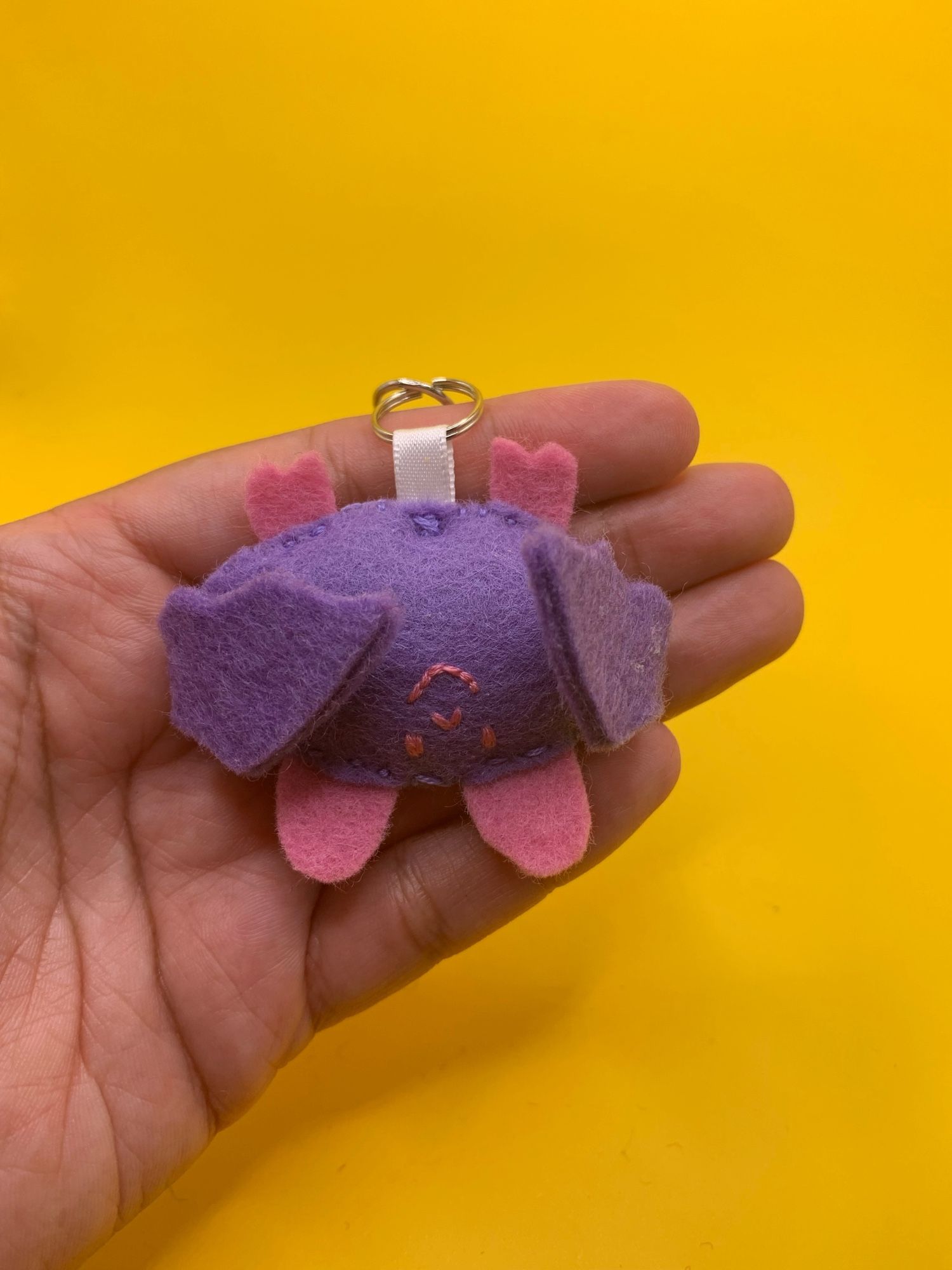 A photo of a felt bat keychain