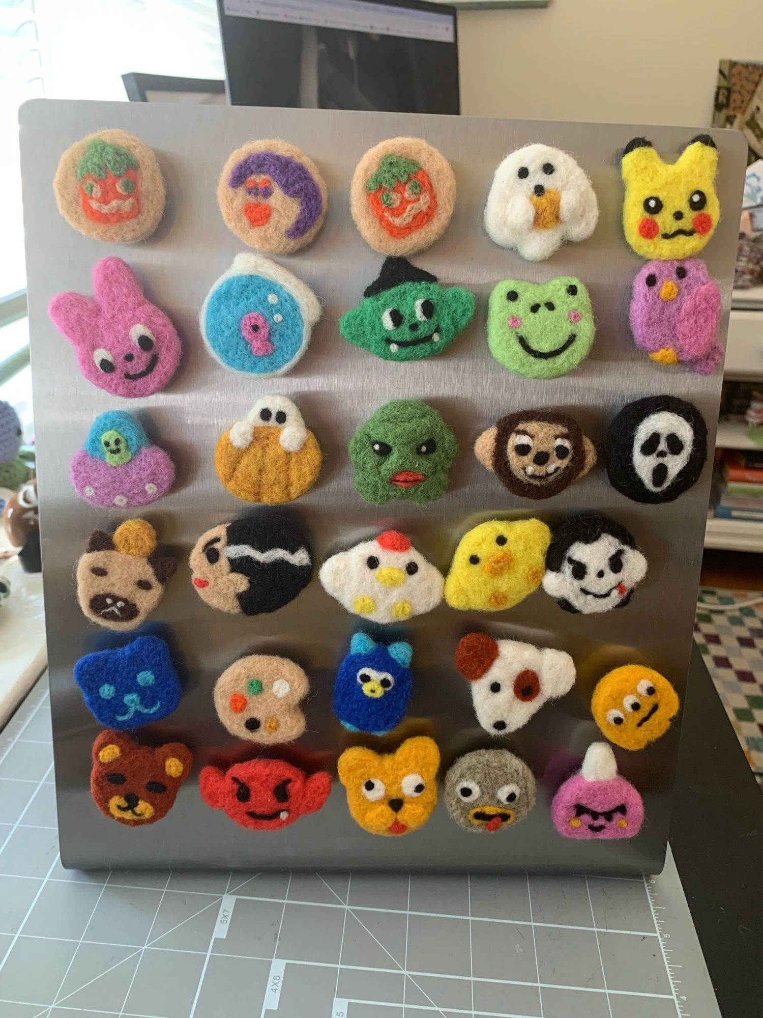 A photo of felt magnets on display