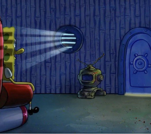 SpongeBob sitting in his chair in a dark room