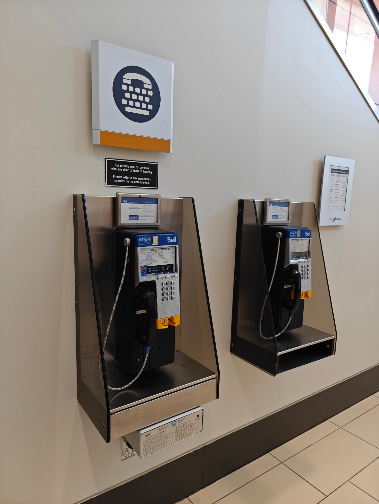 Two payphones in YOW airport, USA cleared side.