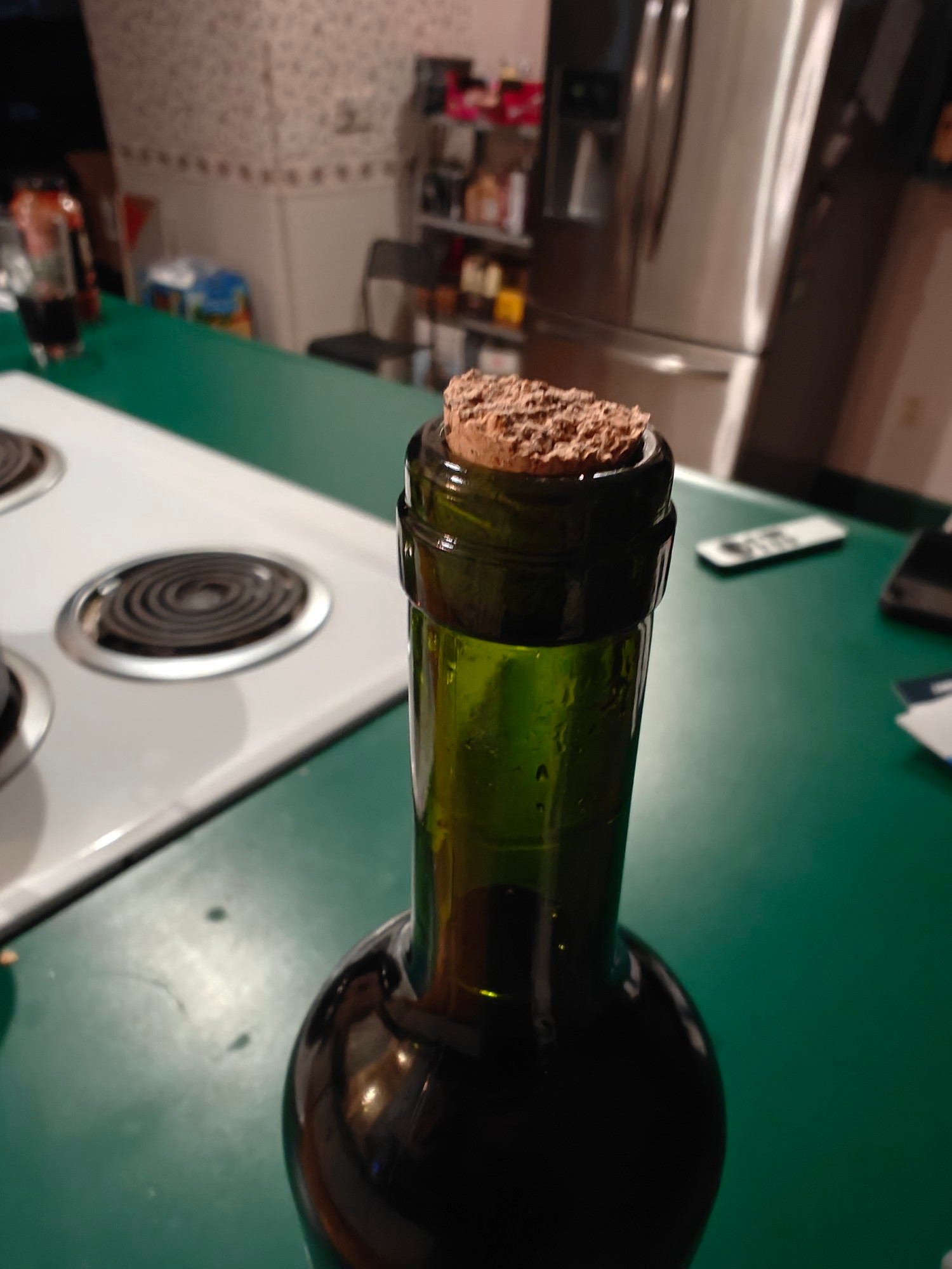 Wine bottle with a broken cork.