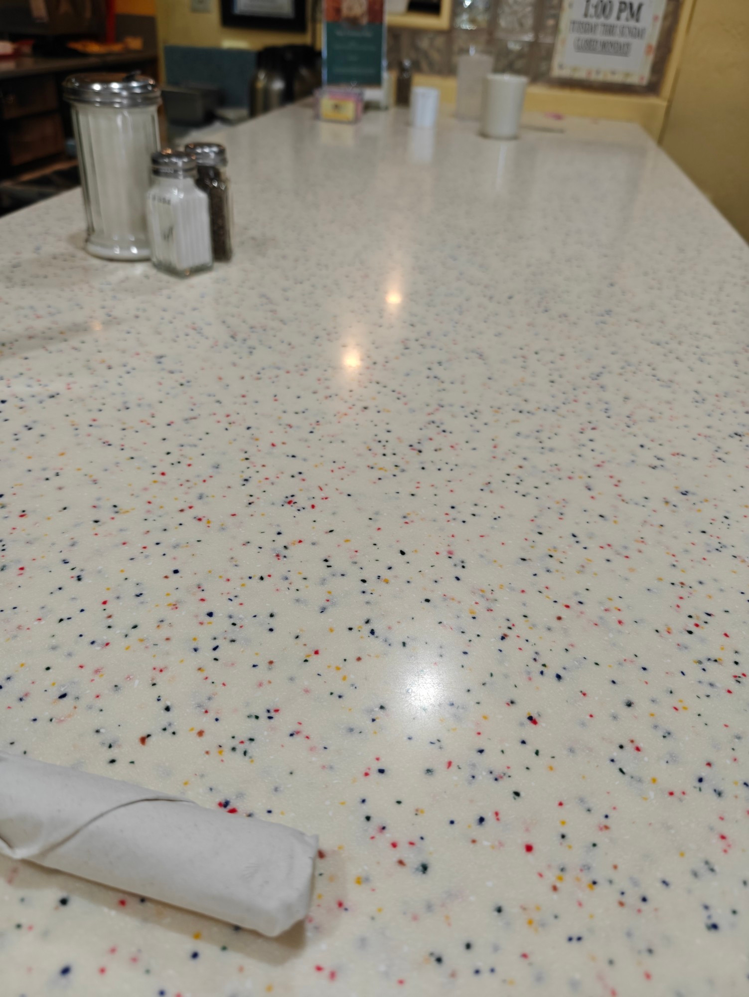 A countertop at a pancake house in Scottsdale AZ. Reminds me of bubble gum and birthday cake.