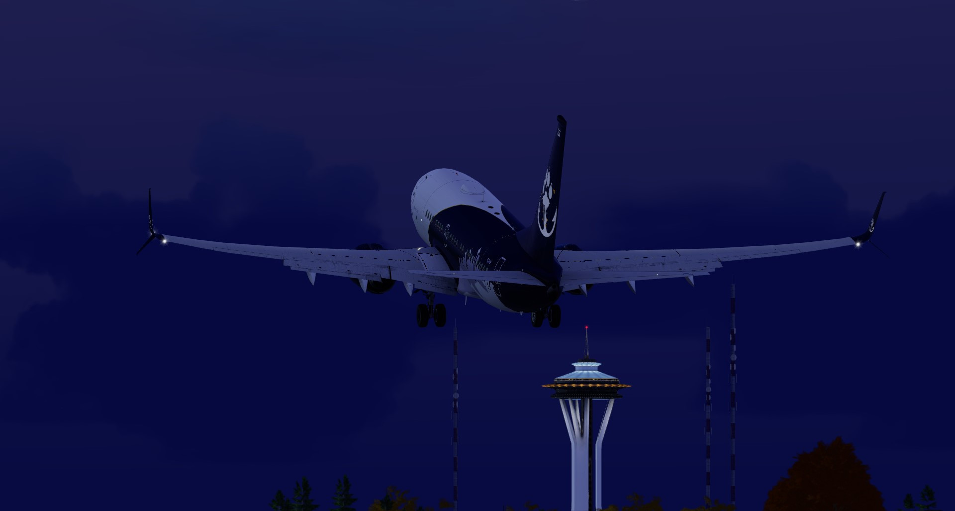 Boeing 737-700 taking off from BFI with the Seattle Space Needle in the back