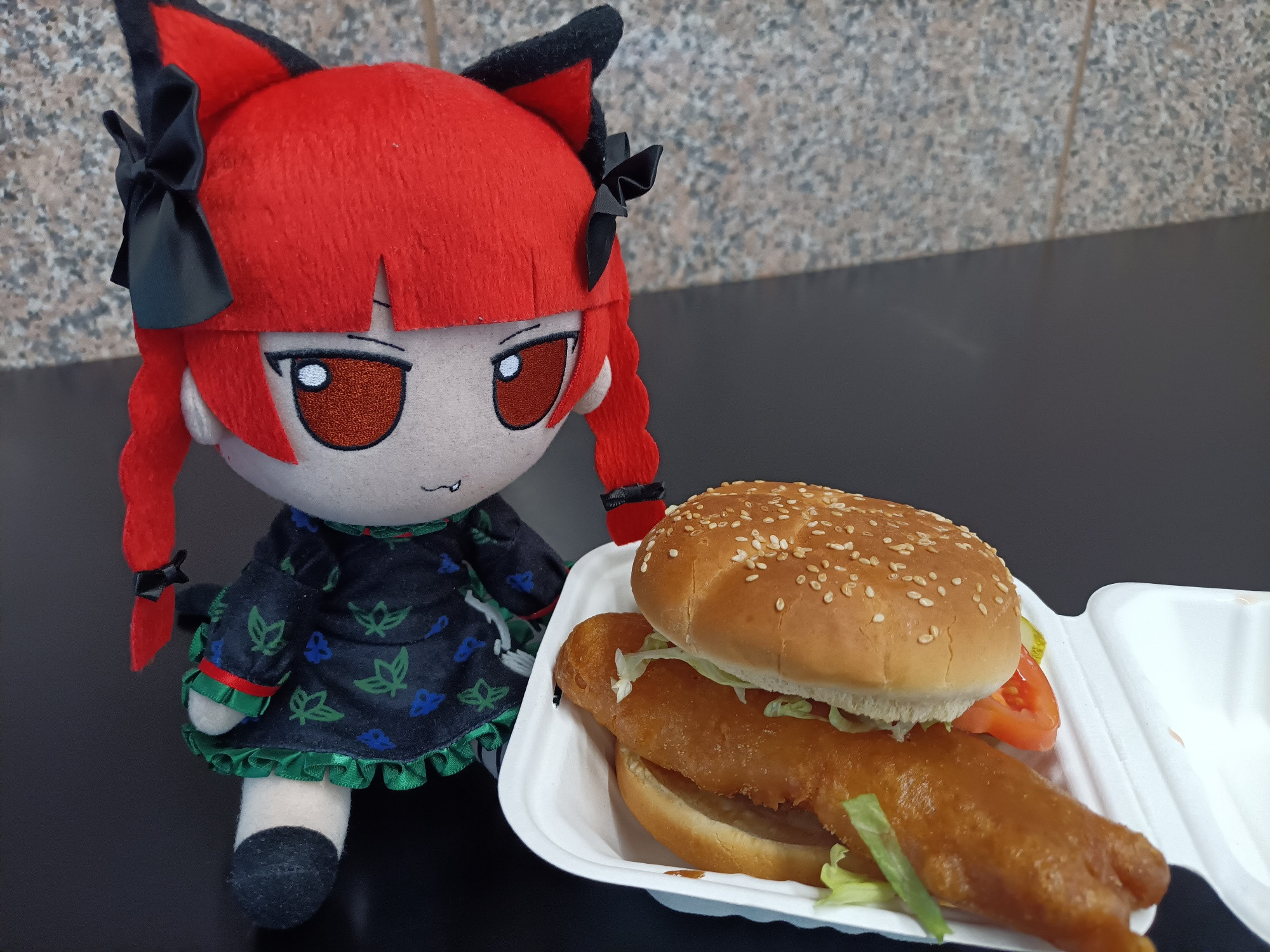 Fumo plush of Rin "Orinrin" Kaenbyou with a real chonker of a fish burg