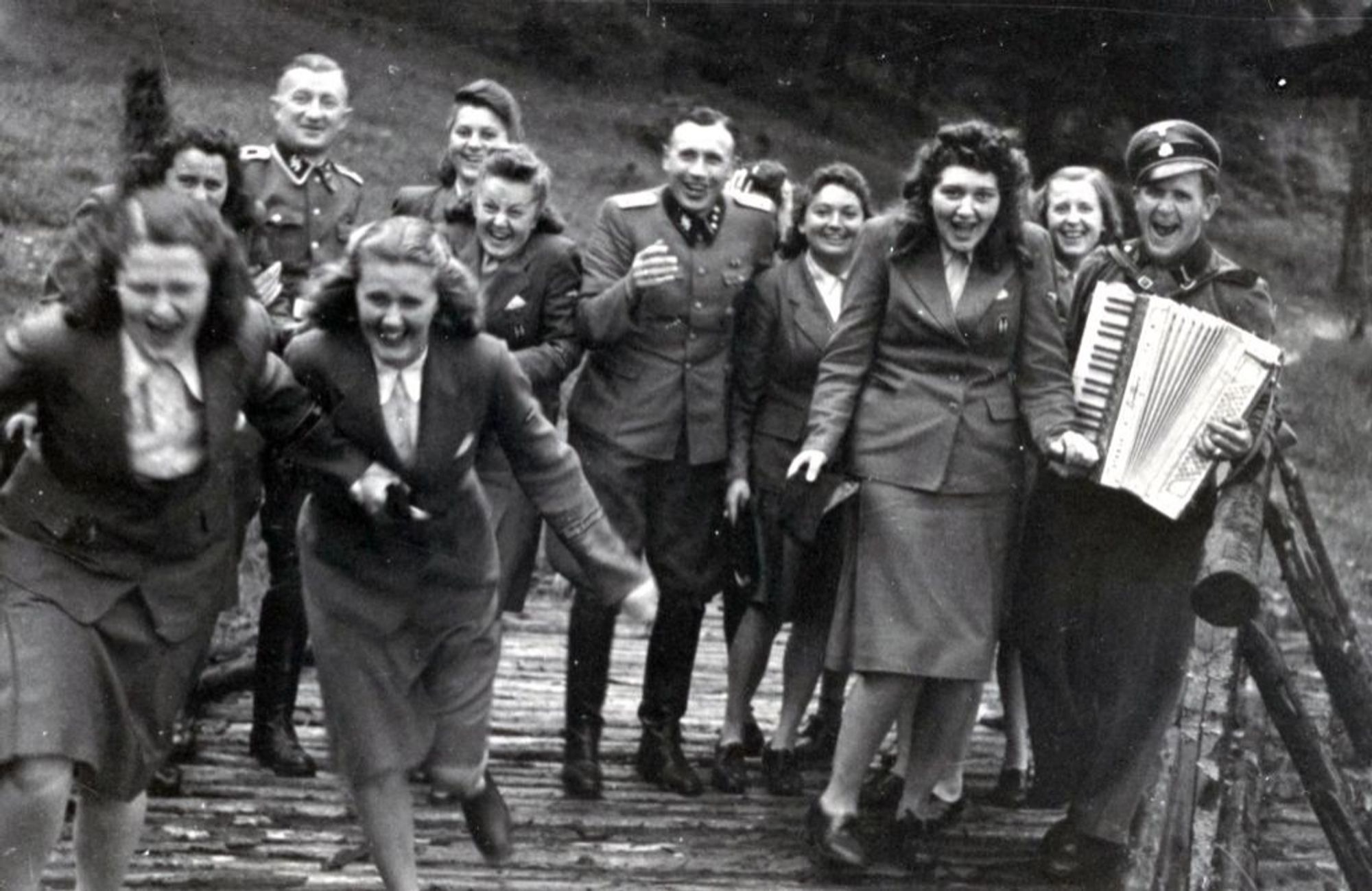 Auschwitz murderers smiling, laughing, playing accordion, having time of their lives