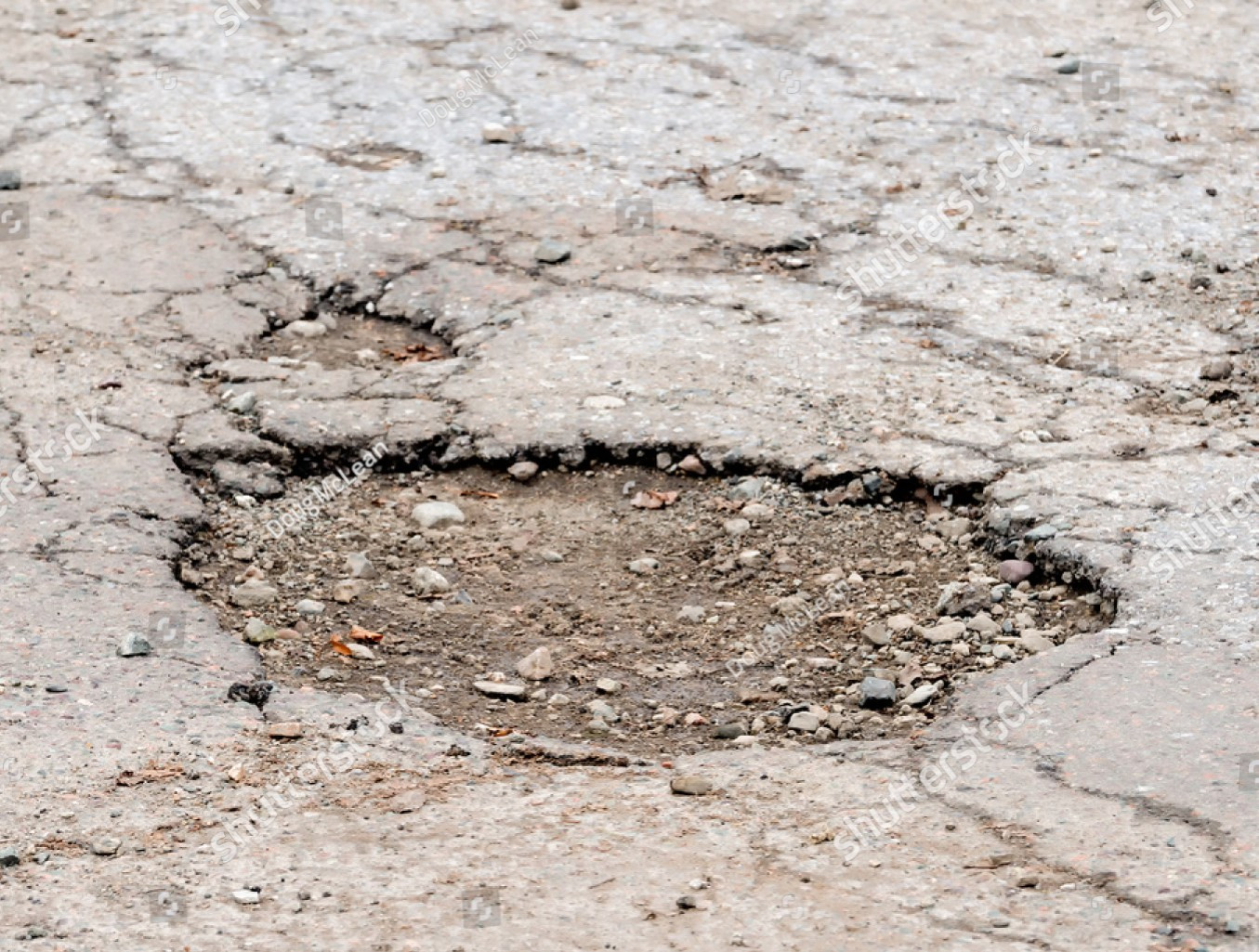 A shallow pothole.