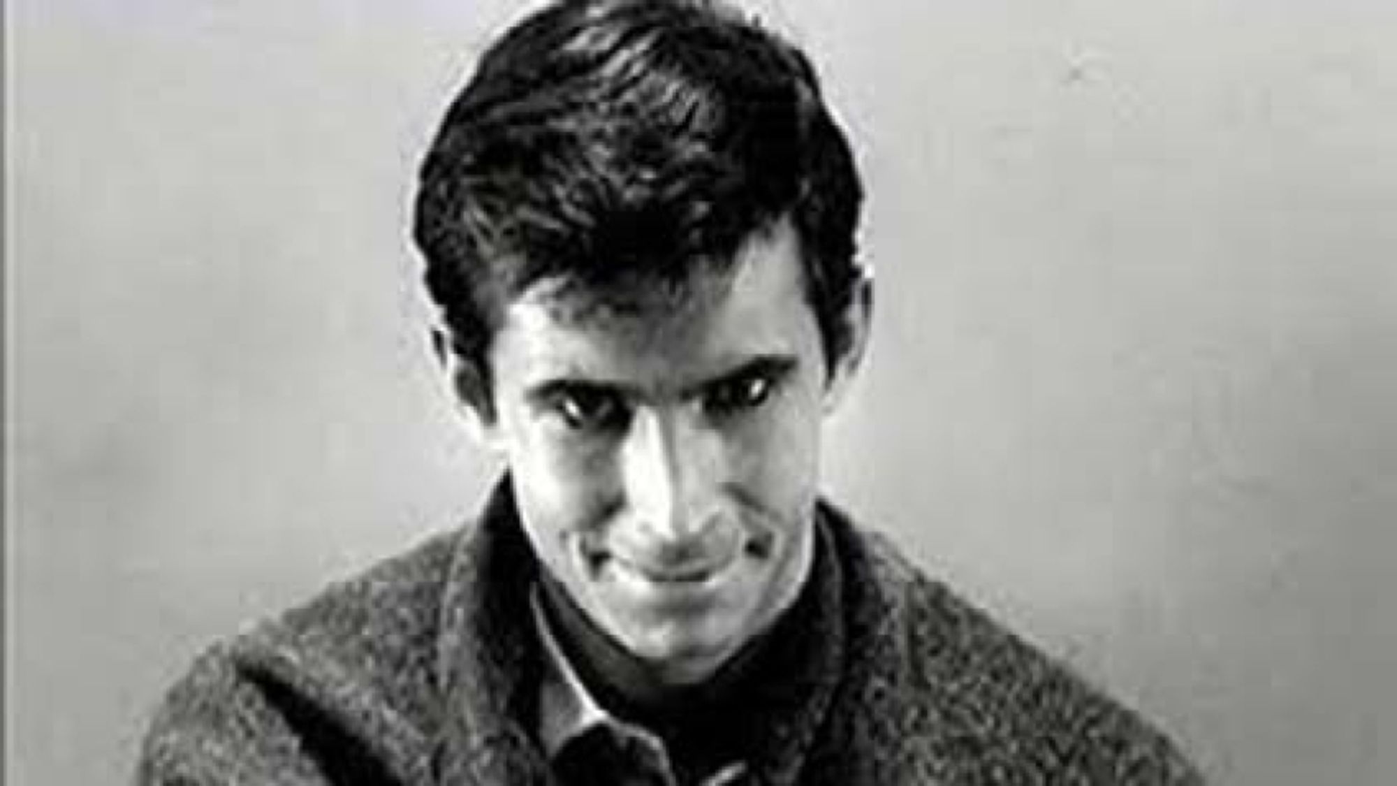 Norman Bates smiles.