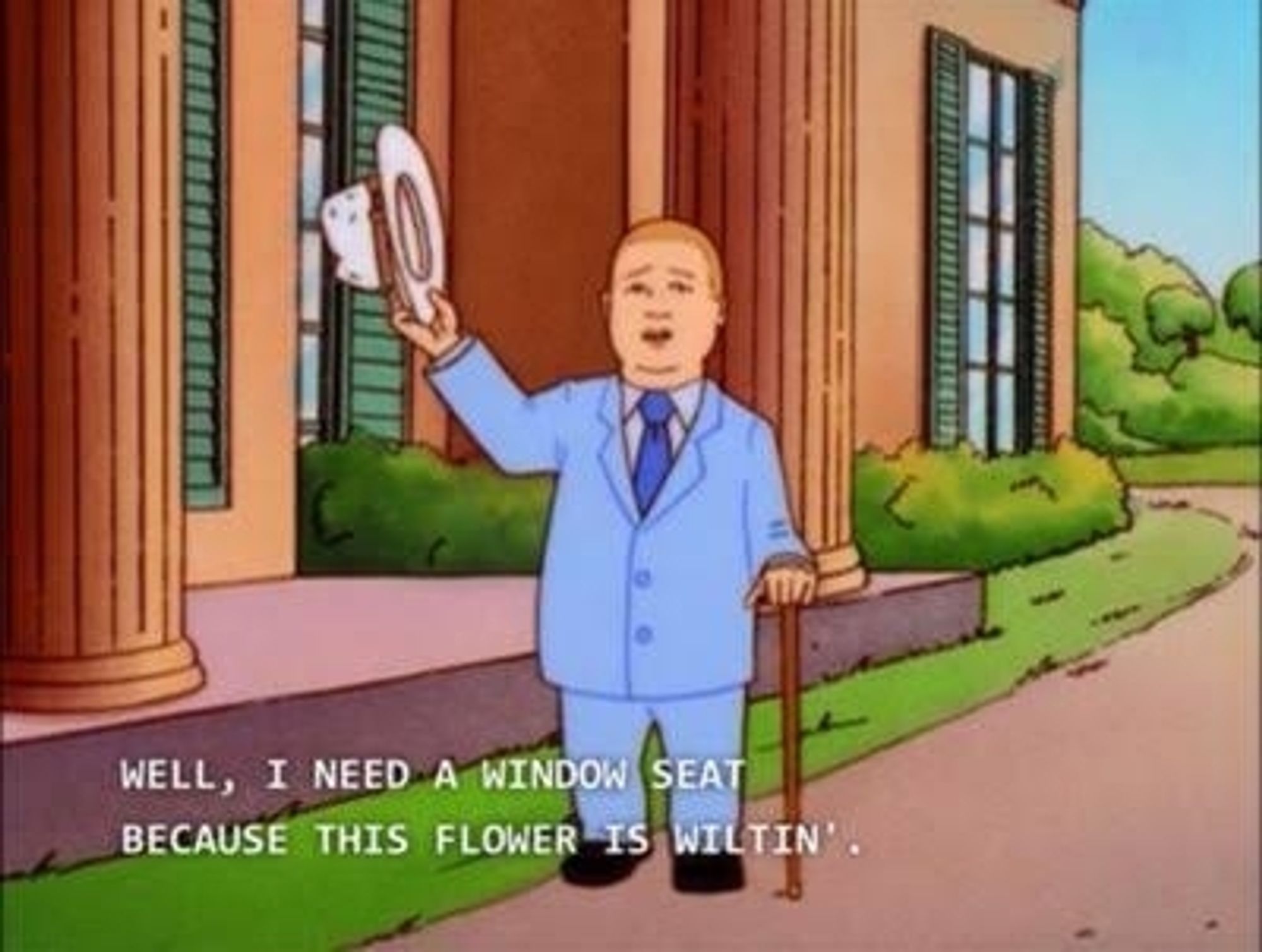 12-year-old Bobby Hill from the 1997 animated sitcom "King of the Hill". He wears a powder-blue velvet (not velveteen) suit and is gaming himself with a hat while leaning on a cane. The subtitles read "Well, I need a window seat because thus flower is wiltin'"