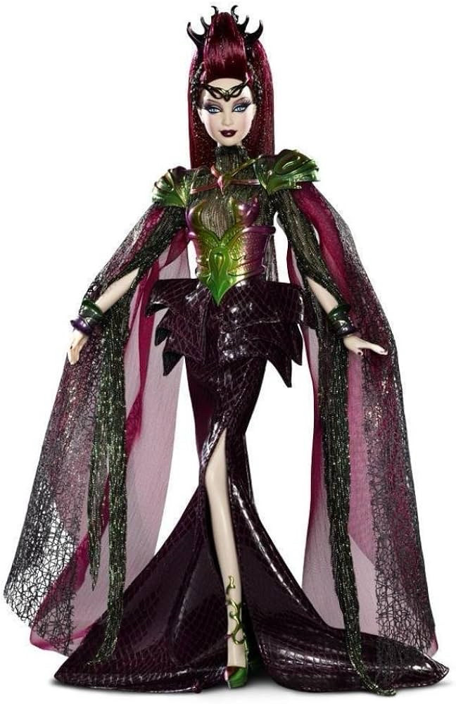 Alien empress Barbie. A pale skinned humanoid alien in a very camp looking number. She’s got an armoured breast plate with shoulder pads in shades of gold and green. She has these sort of cape things falling from the shoulder blades. They are made from a dark, web-like material. She has a snakeskin, floor length, fishtail skirt with a slit. It has a spiky sort of construction around the waist. 