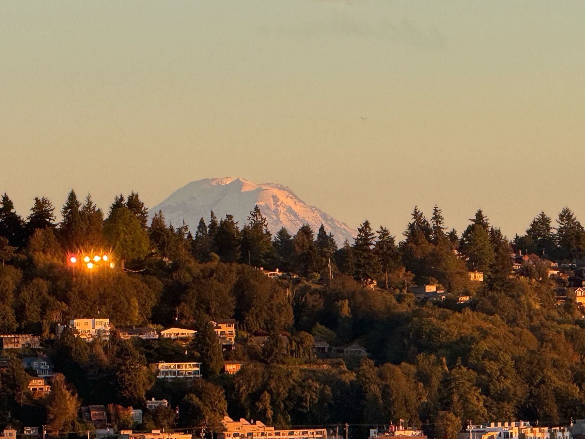 A picture of Tahoma / Mount Rainier barely peeking over the hills of West Seattle.