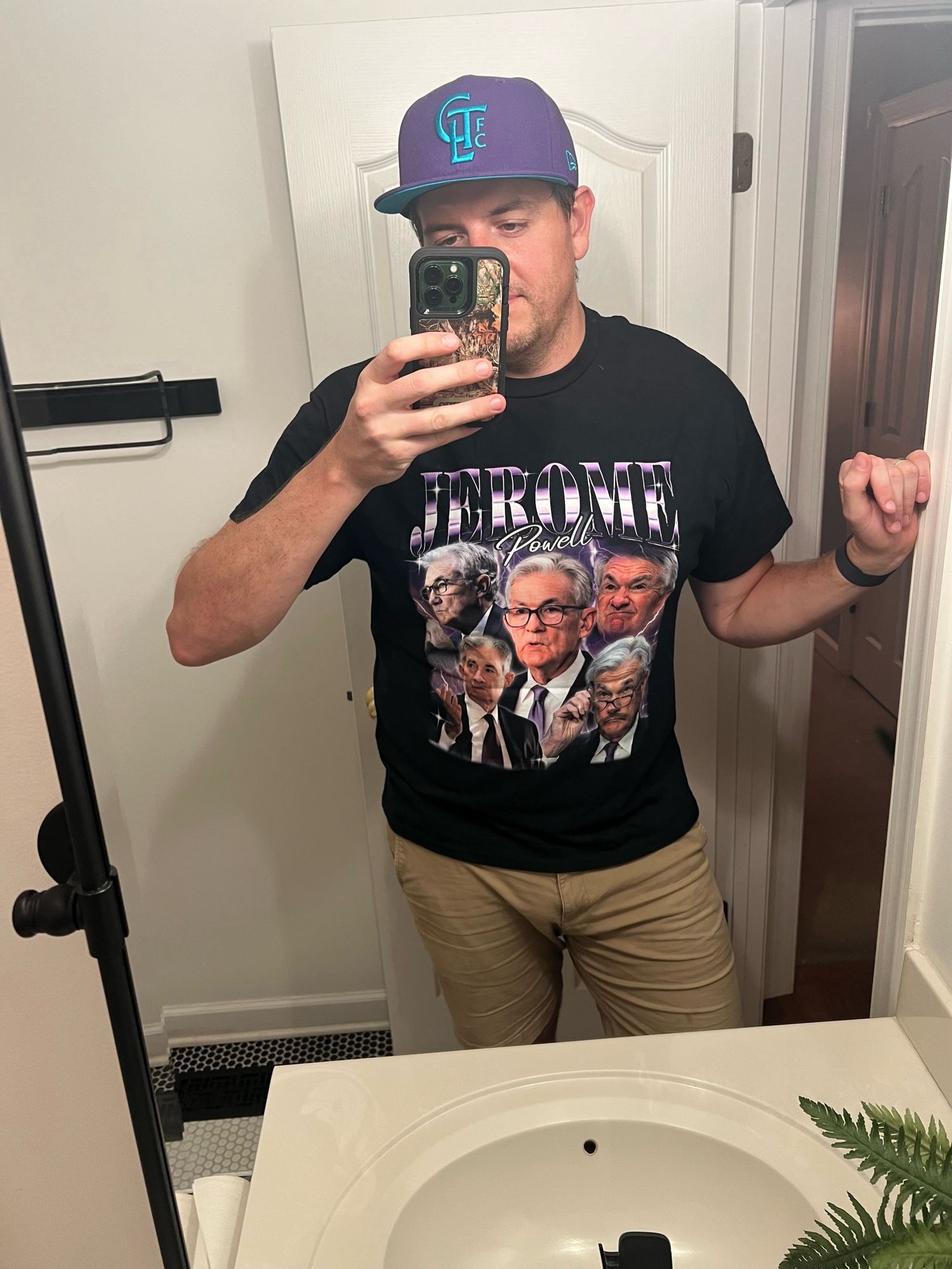 The poster in a Jerome Powell vintage tribute shirt