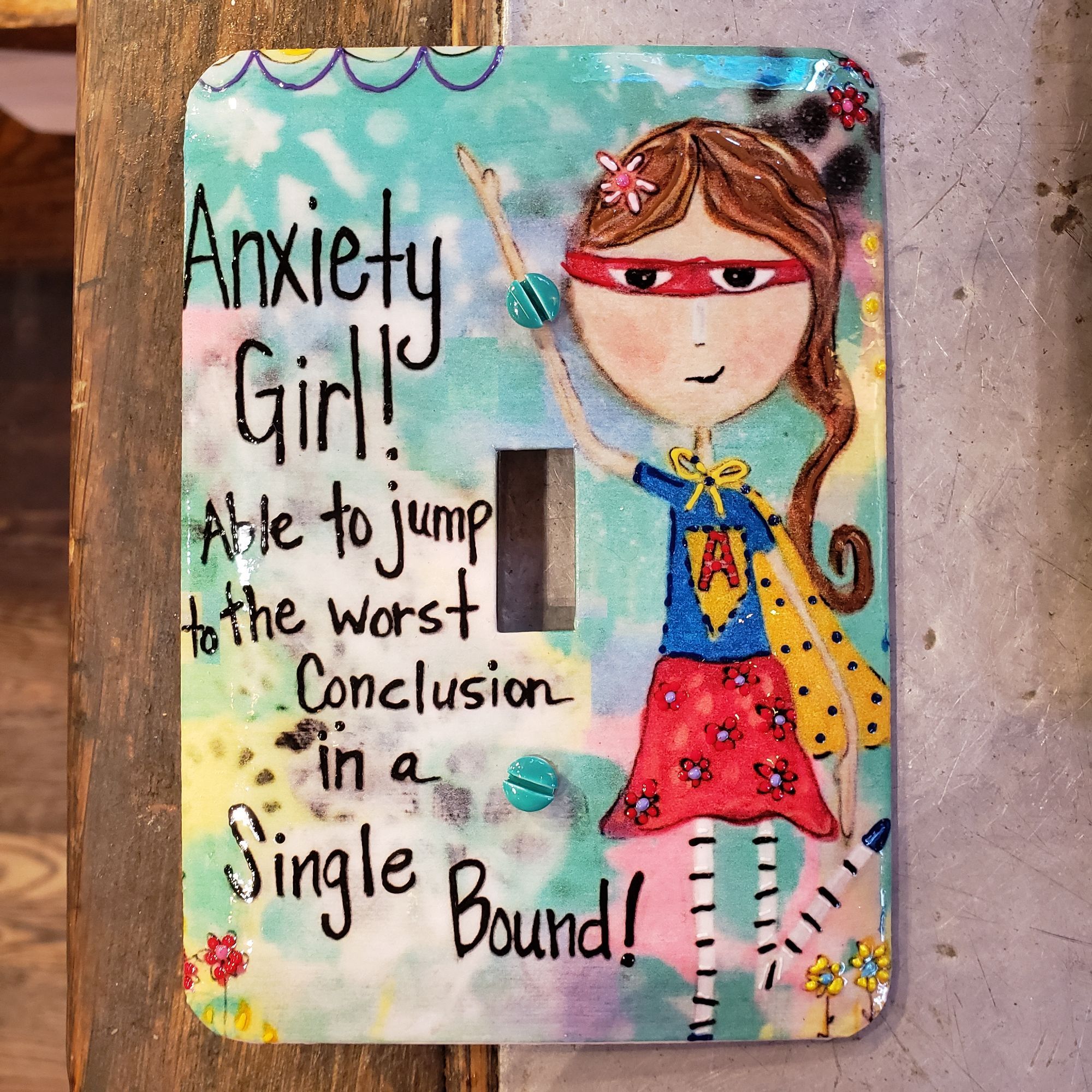 Light switch cover with "Anxiety Gir! Able to jump to the worst conclusion in a single bound!"