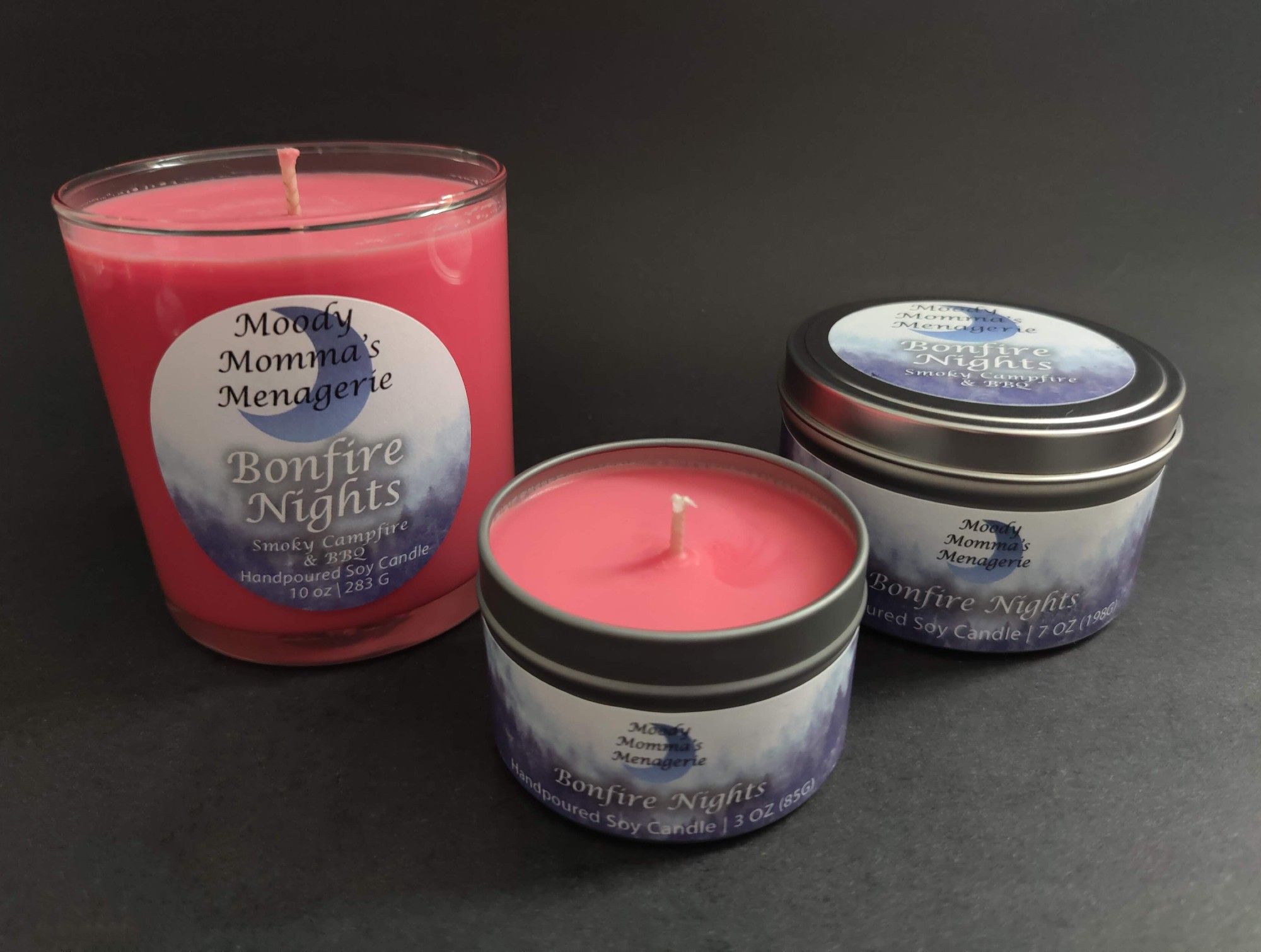 Three different sizes of yellow soy candles in Bonfire Nights, a smoky campfire fragrance with notes of raspberry