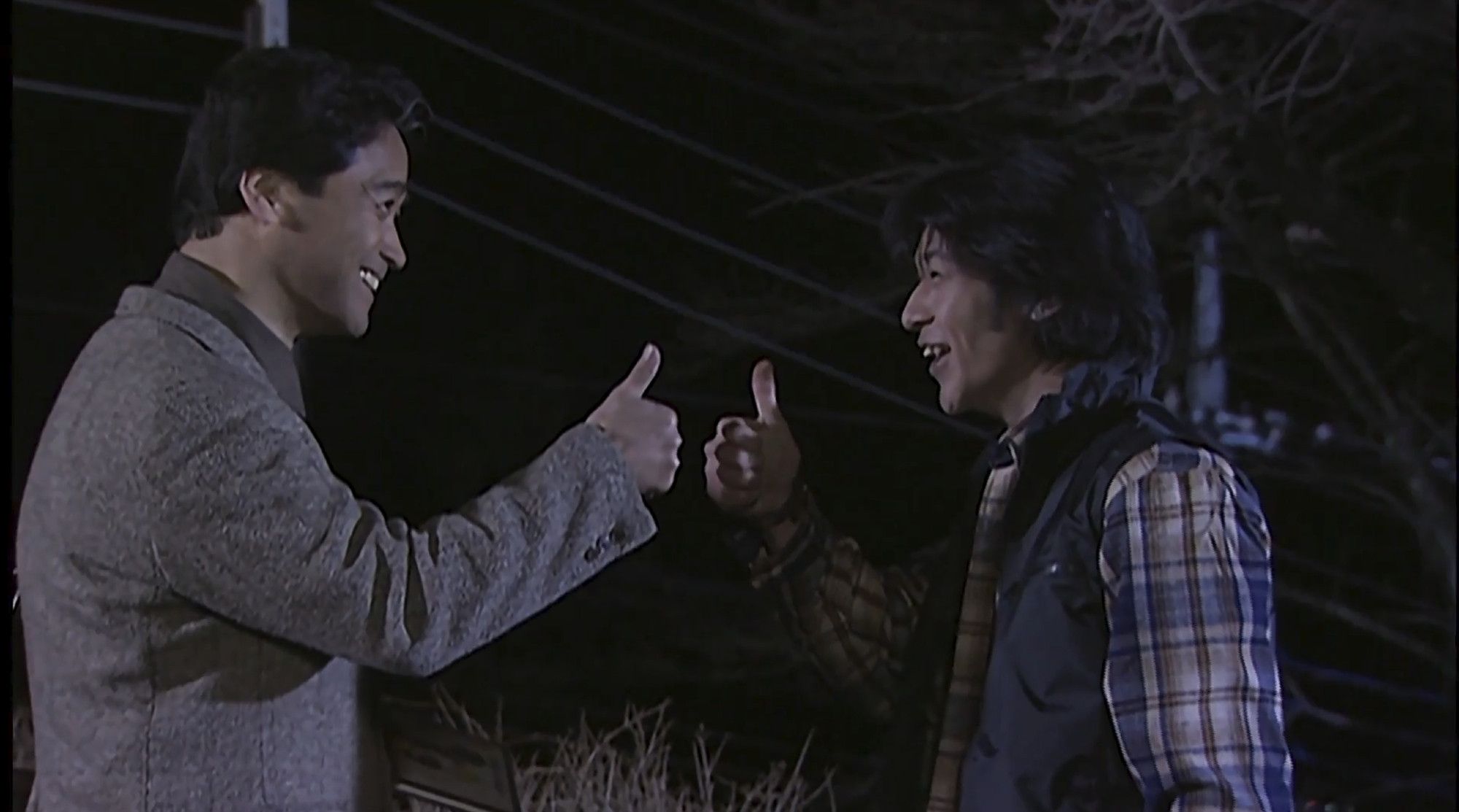 Yusuke Godai and Mr. Kanzaki giving eachother a thumbs up at the end of the episode, a sign of their long awaited promise being completed to satisfaction.