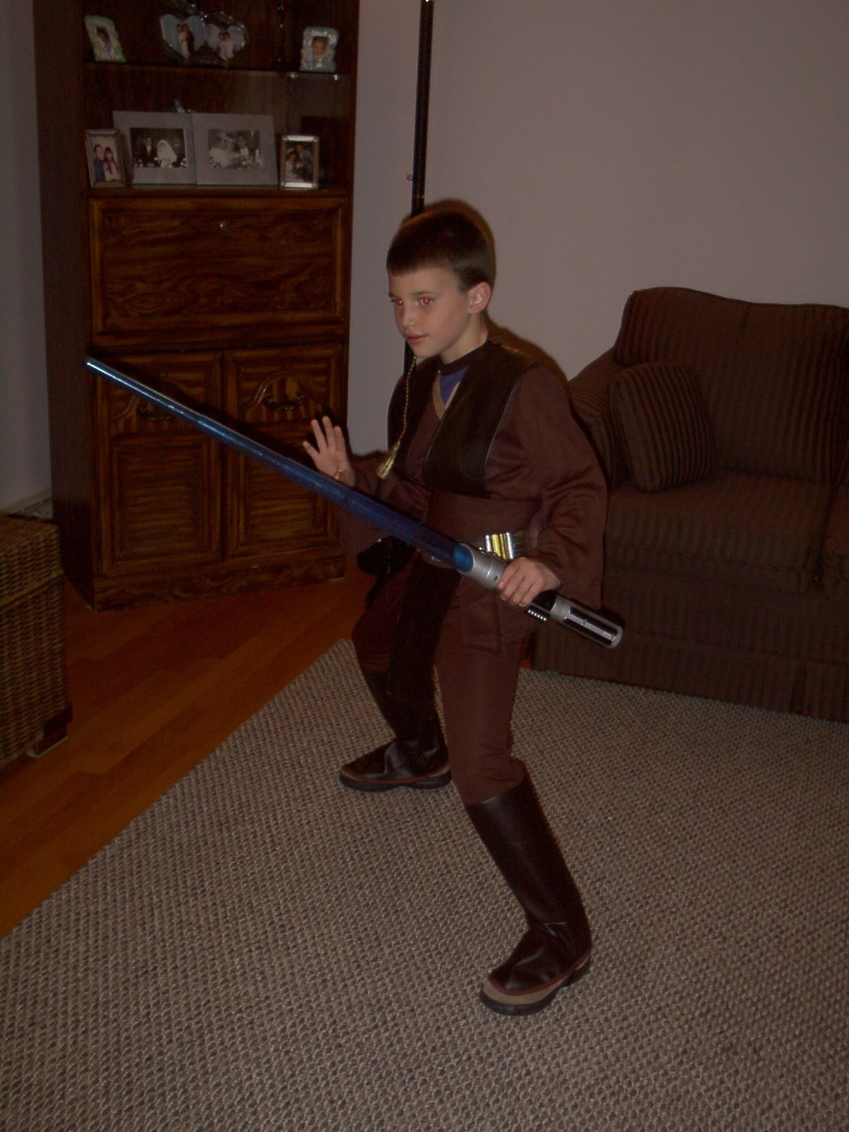 a photo of 10-year-old Colton dressed as Padawan Anakin Skywalker from Attack of the Clones. He's very cute