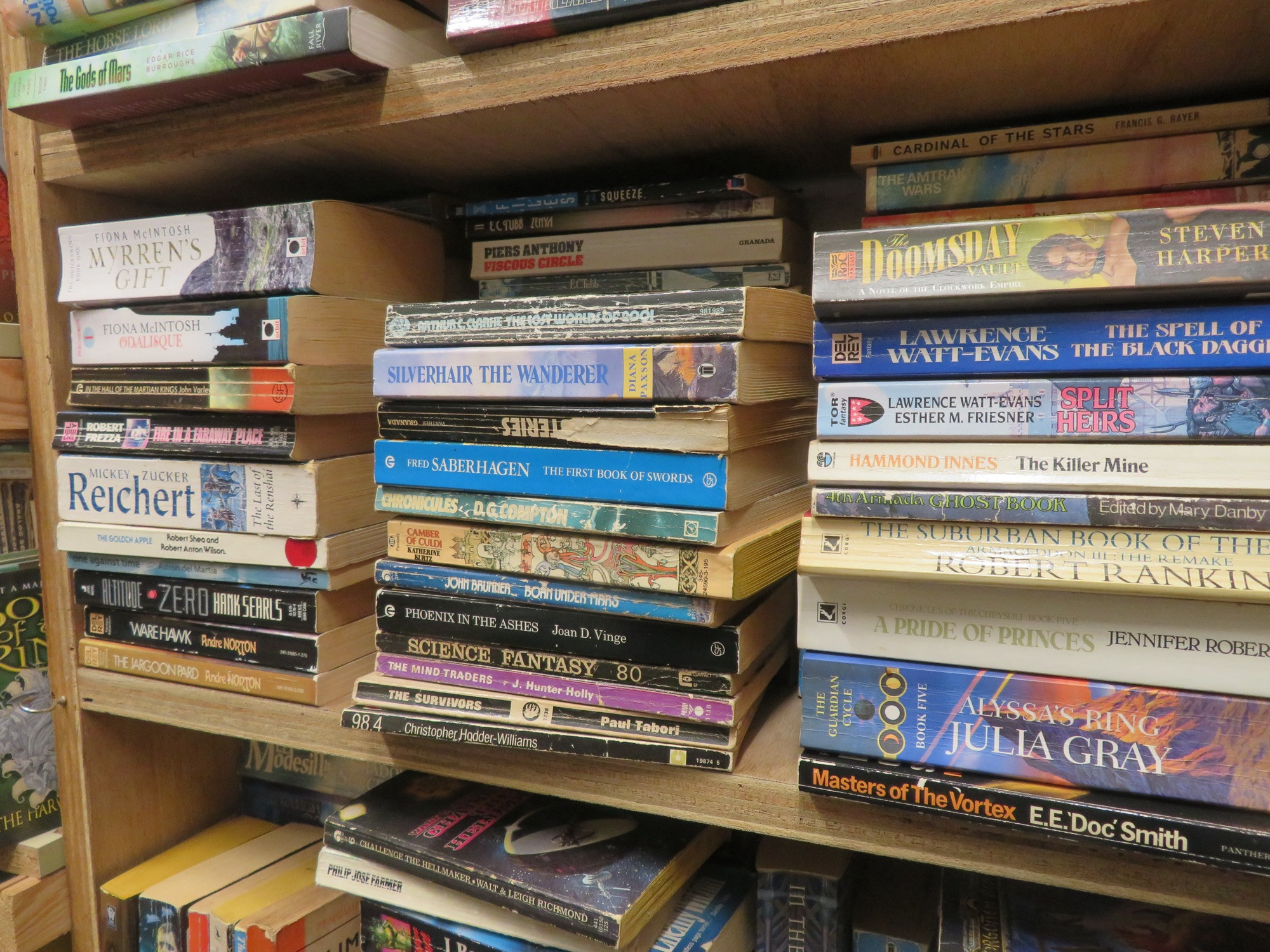 A pile of fantasy and science fiction books.