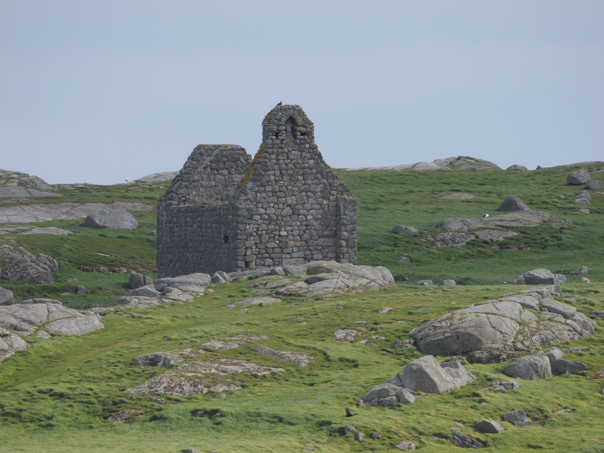 An old stone chapel (?) on a grey rocky, short-grassed island