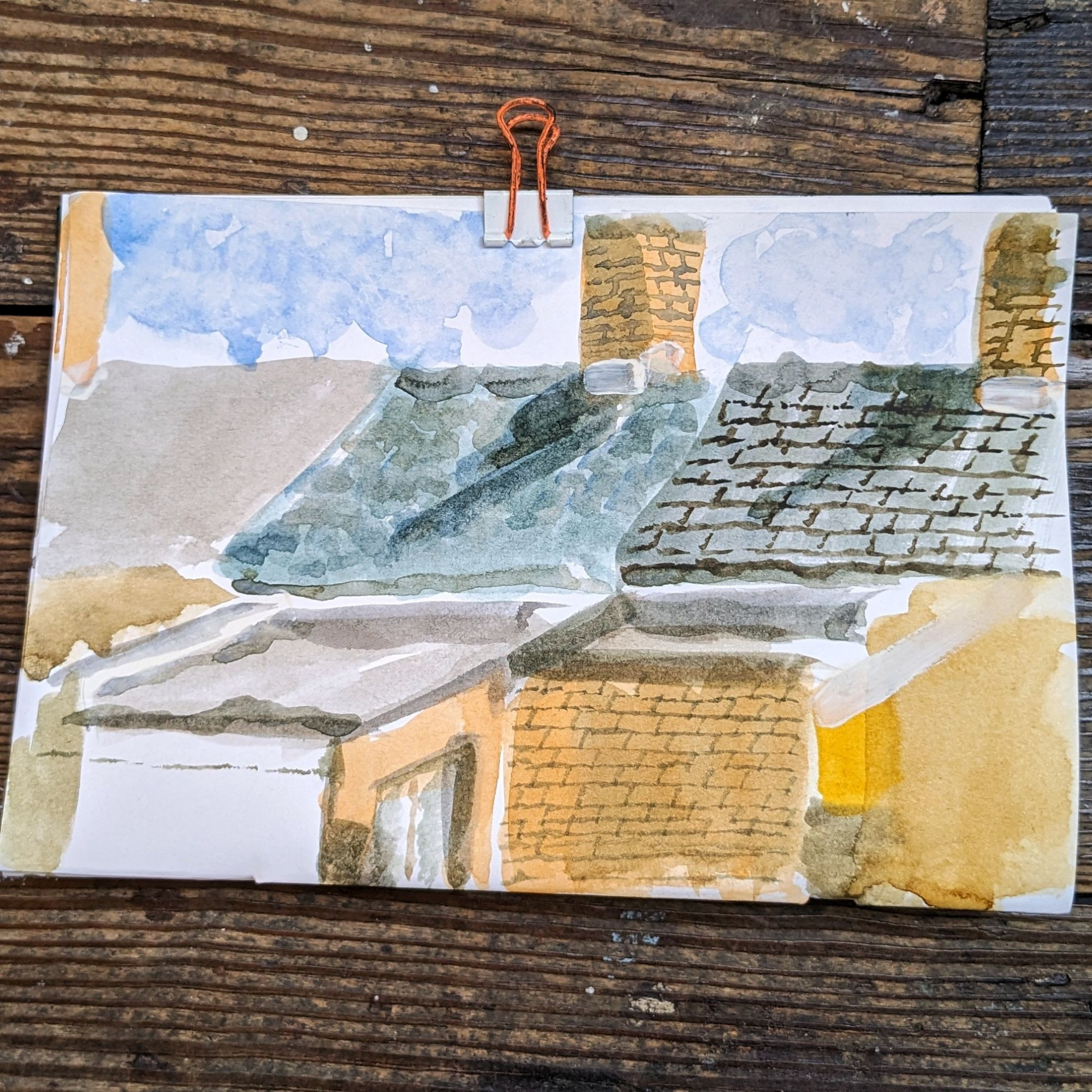 A watercolour sketch by Kip of the red brick buildings outside their studio window