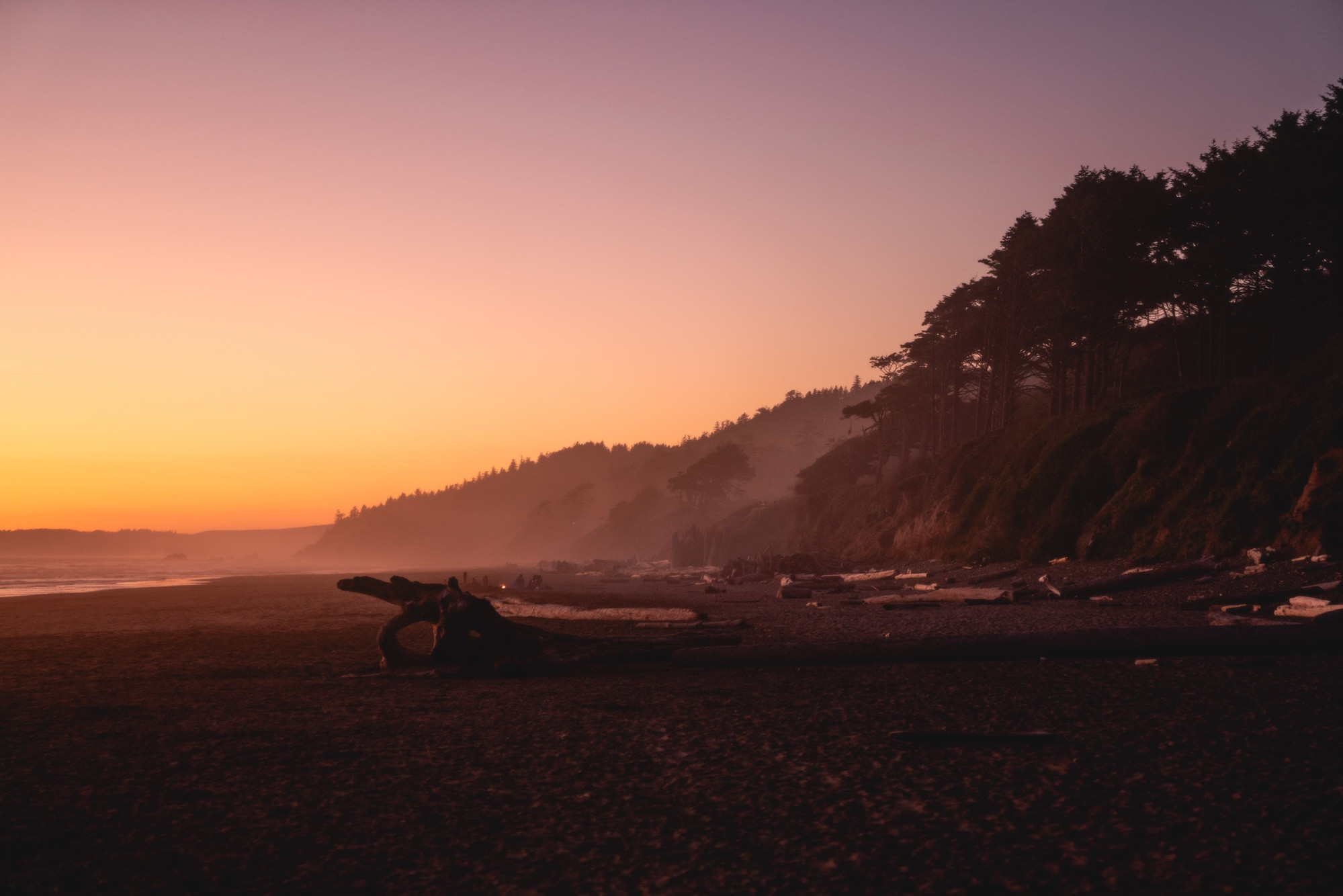 A hazy beach at sunset