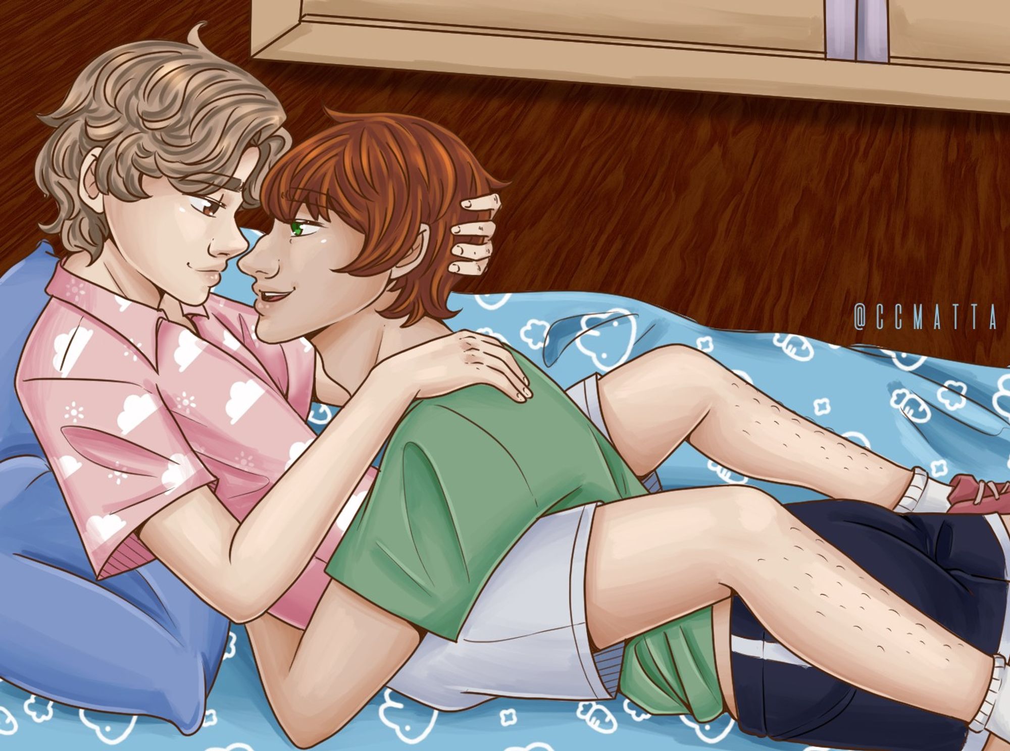 Drawing of my characters, Nate and Matt. Nate is sitting on the floor, his body is facing right; Matt is laying on front of him, nested between Nate's legs and hugging his back. Their faces are close, both are smiling. Nate has curly brown hair; Matt has orange-red hair. Nate is wearing a pink shirt with white clouds pattern and gray shorts; Matt is wearing a green t-shirt and black shorts. They're on top of a blue blanket with bunny pattern all over and a blue pillow. In the back you can see the bottom of a wardrobe and the floor is a dark wood.