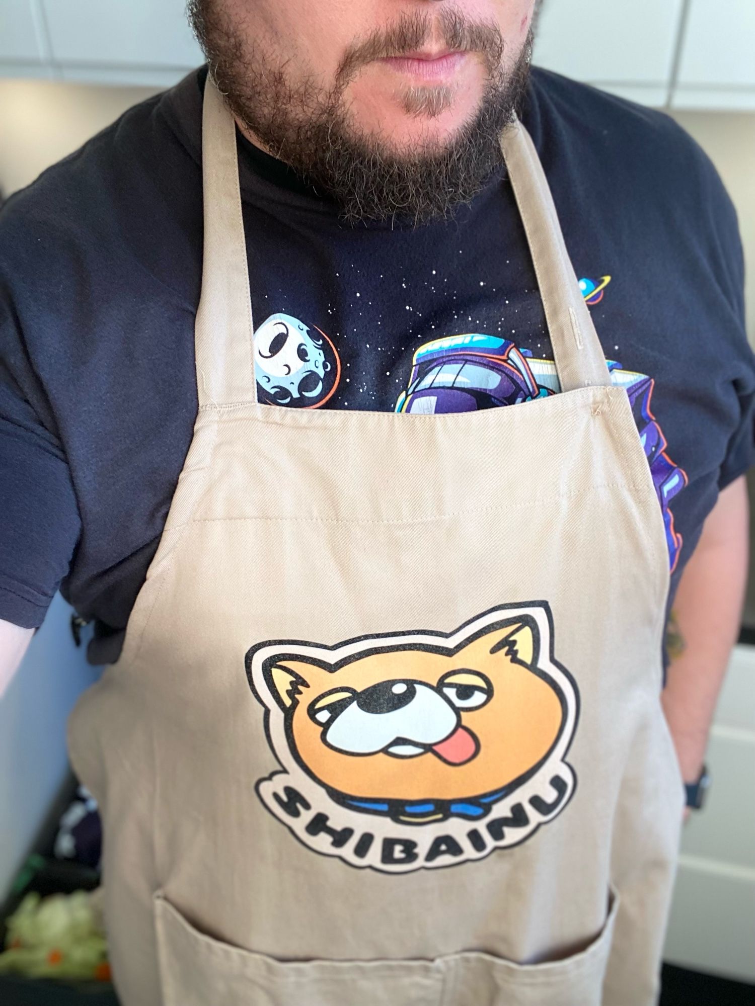 Me in my Way of the Househusband apron, featuring Tatsu’s iconic SHIBAINU design