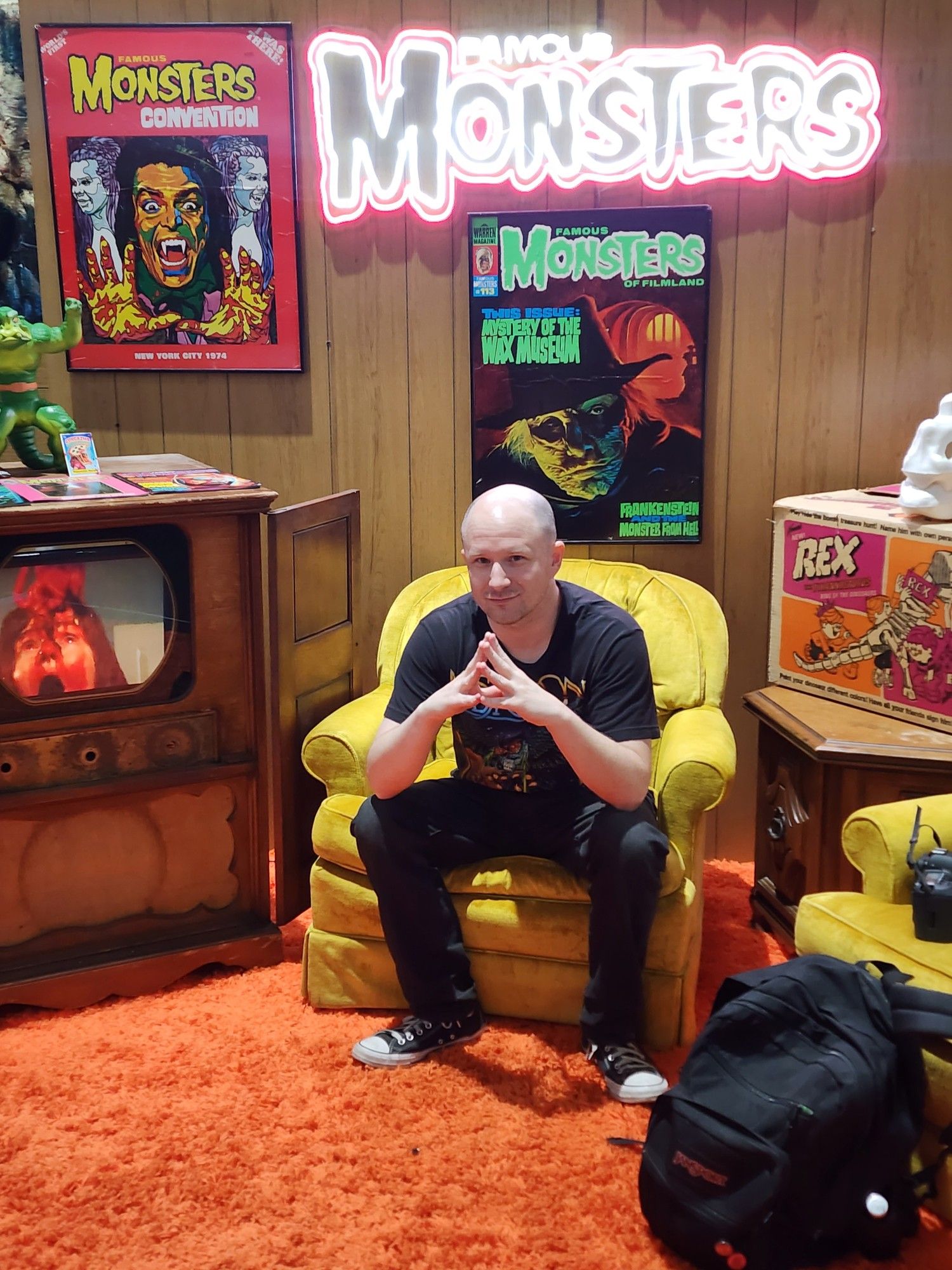 Chris Lockey sits on a chair in the Famous Monsters booth during SDCC 2024.