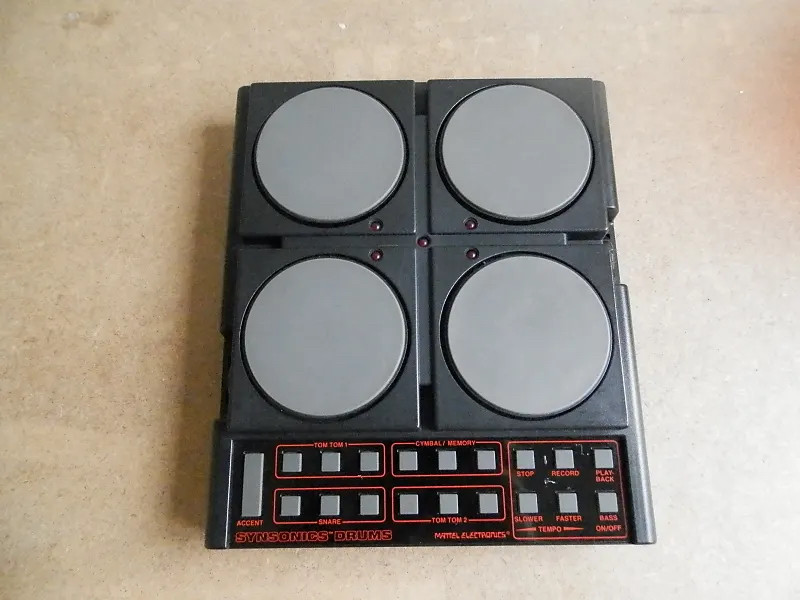 Mattel Synsonics drum machine, it has four pads and a bunch of buttons at the bottom for sequencing