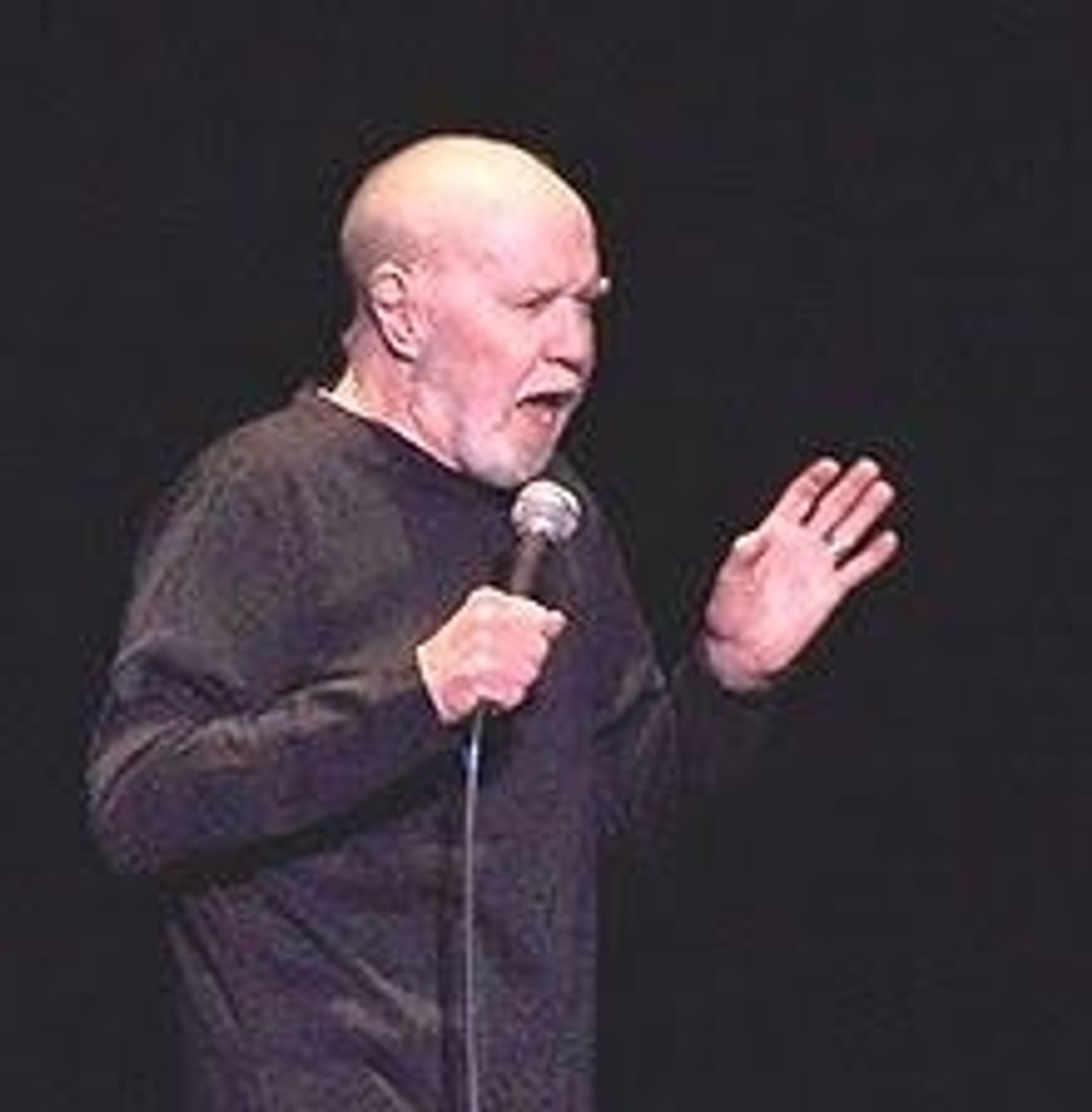 George Carlin performing.