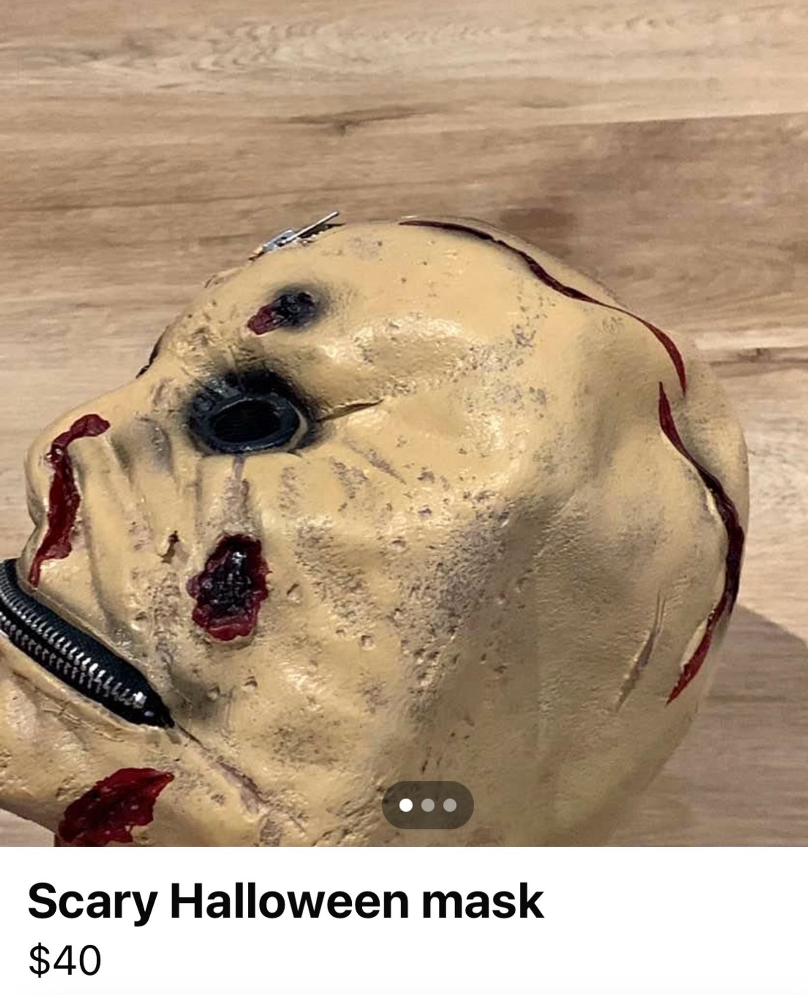 Scary Halloween mask with a zip where the mouth should be