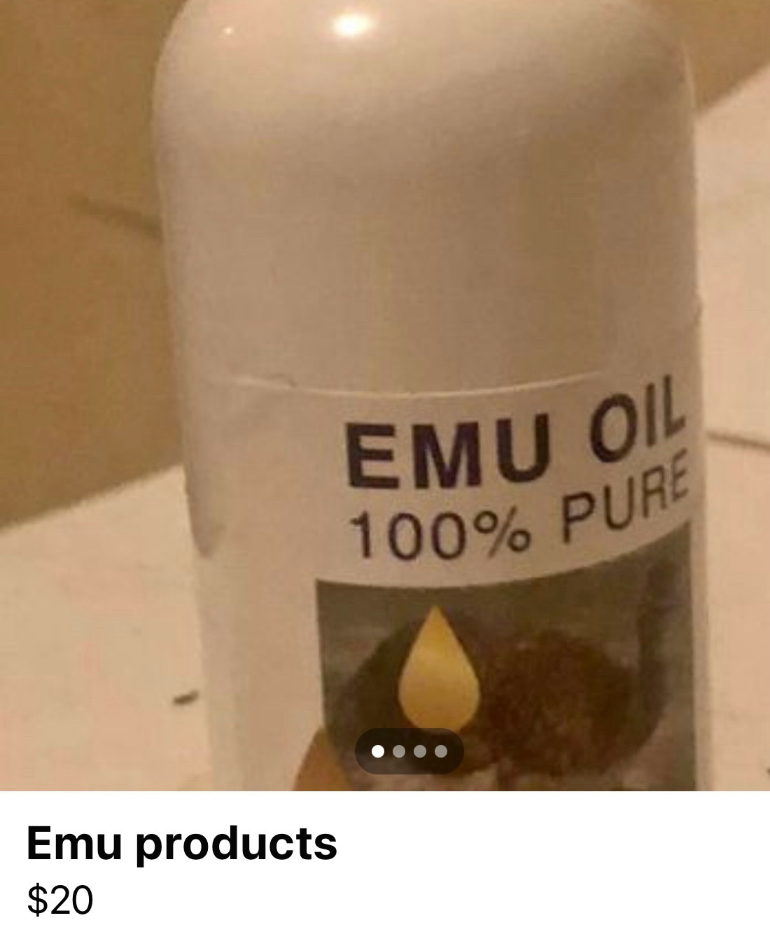 Small white bottle of emu oil