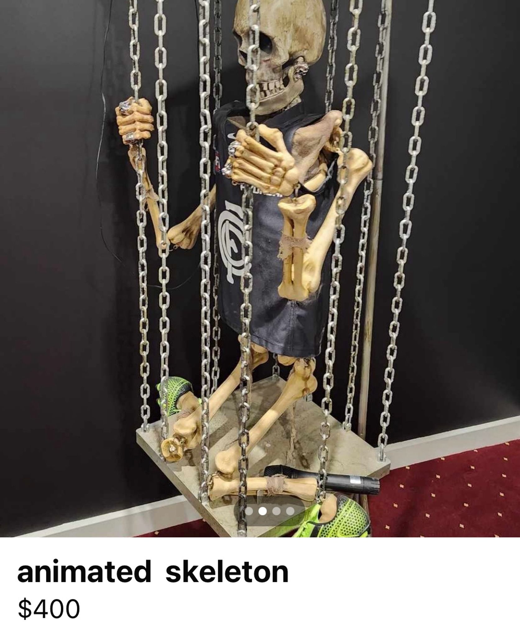 Skeleton in a cage wearing a AFL Carlton jumper