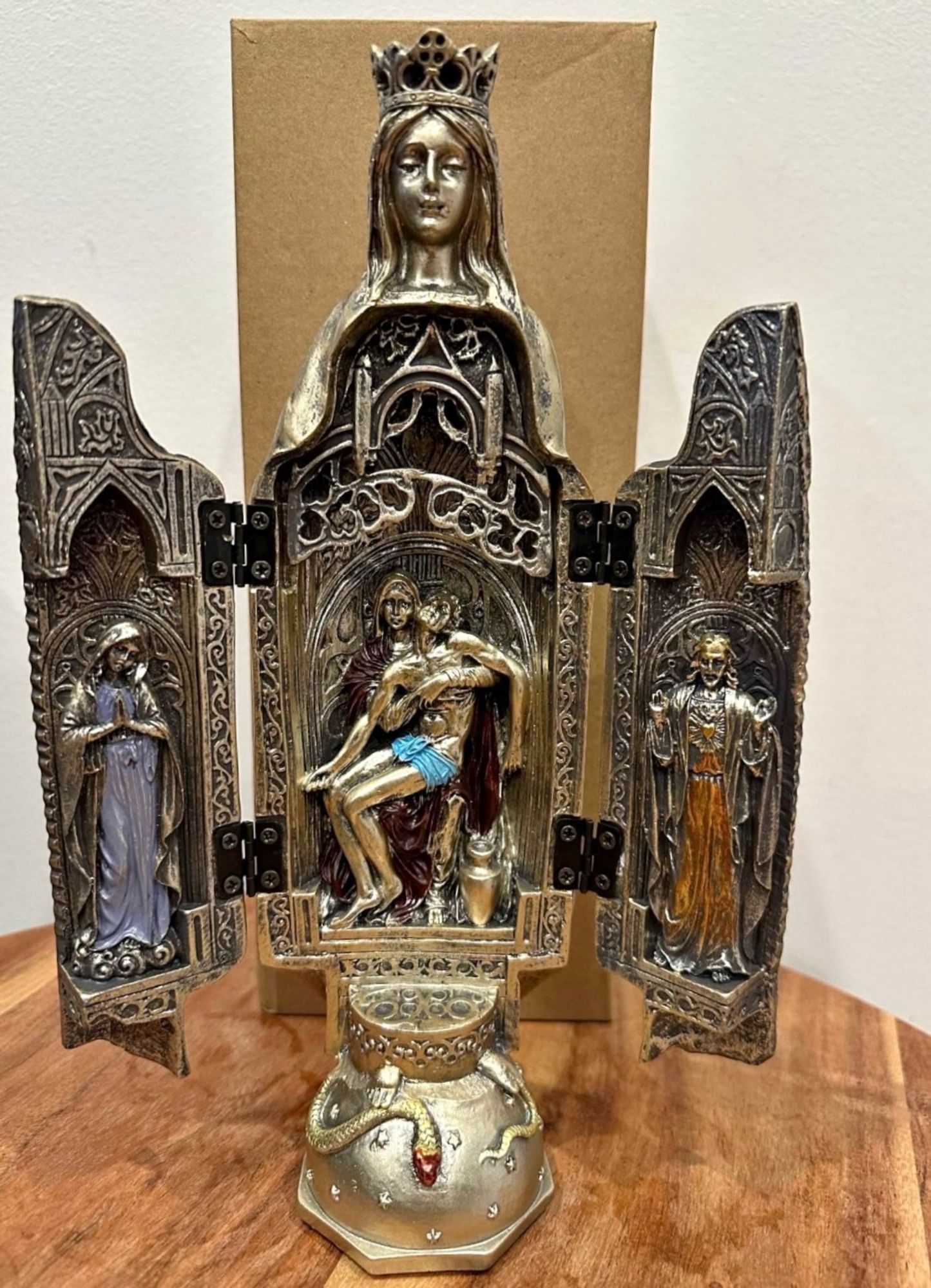 A statue of the Virgin Mary fully open revealing a crucified Jesus inside her