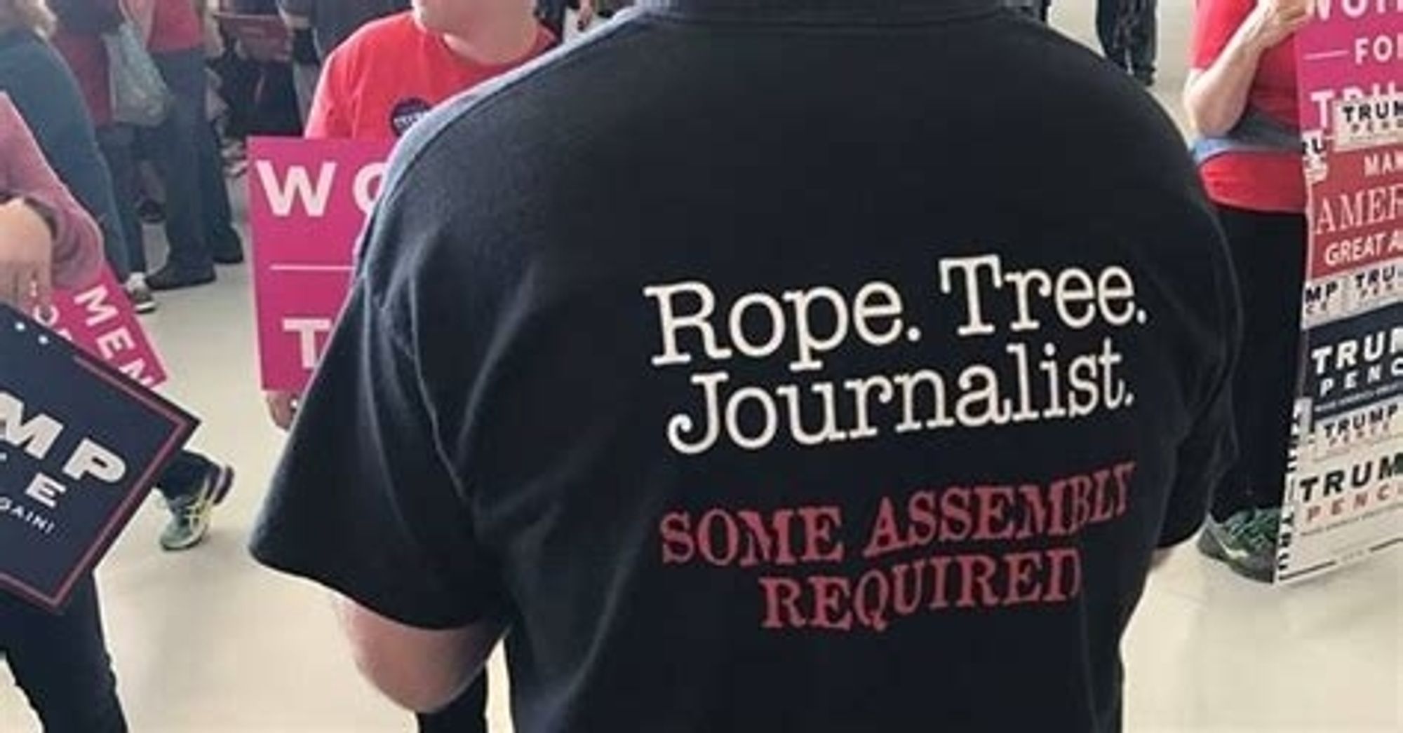 man wearing a black shirt that says "Rope. Tree. Journalist. Some assemble required" on the back